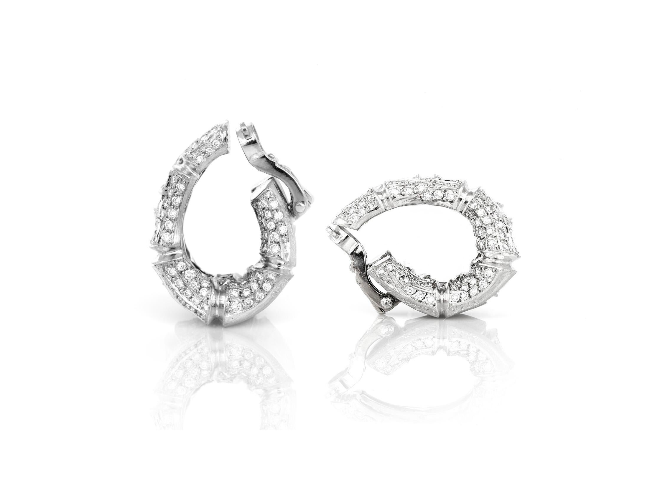 An elegant modern deco inspired Cartier hoop clip-on earrings crafted in 18k white gold with brilliant white round diamonds.  Available in a set with a complimenting ring.  Please inquire if interested.