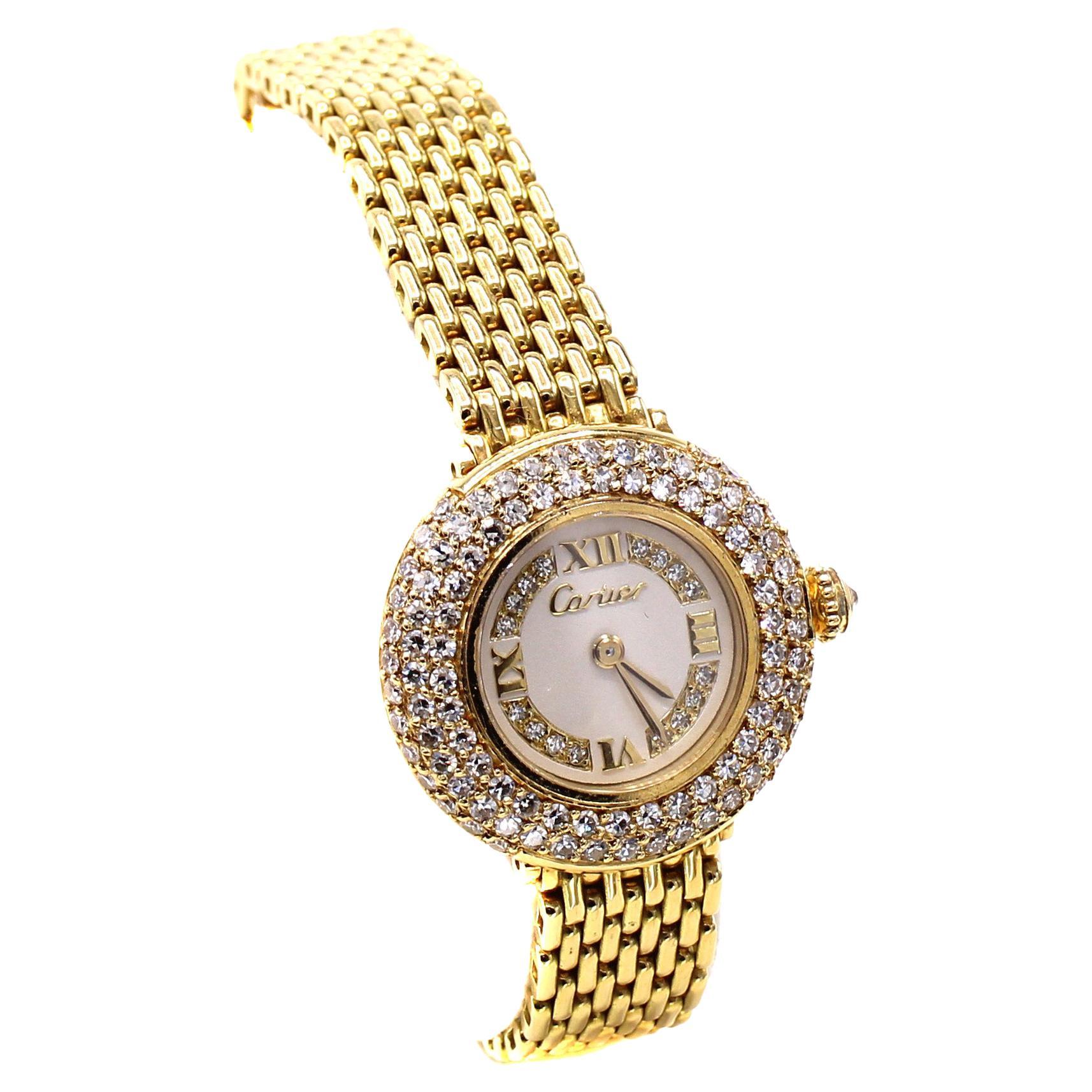 Cartier 18 karat yellow gold ladies wristwatch with original bracelet and hidden deployment buckle. Inner circumference 6.5 inches with extra links to expand to approximately 6.9 inches circumference. The round case is set with a bezel with 3 rows