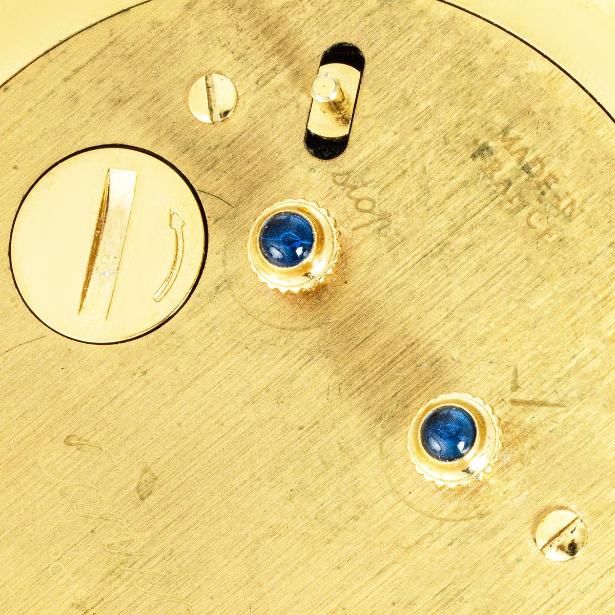 Inspired by Cartier’s 1920s Art Deco style, this Colisée desk clock features a white enamel dial displays black Roman numerals, a minute track, black sword hands, and a white alarm hand.

Powered by a quartz movement with an alarm function, the