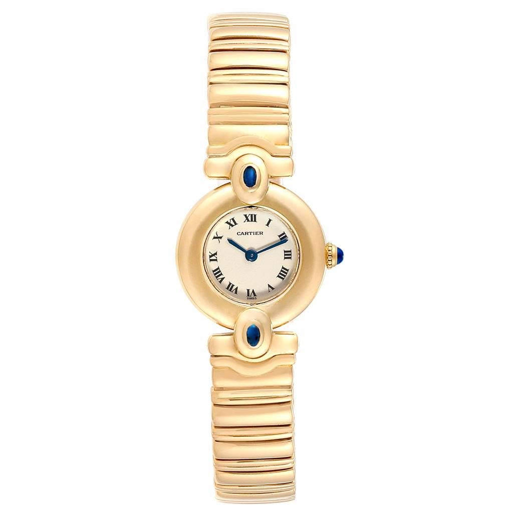Cartier Colisee VLC 18K Yellow Gold Sapphires Ladies Watch. Quartz movement. 18k yellow gold case 23.8 mm in diameter. Circular grained crown set with the blue sapphire cabochon. 18k yellow gold fluted bezel. Scratch resistant sapphire crystal.