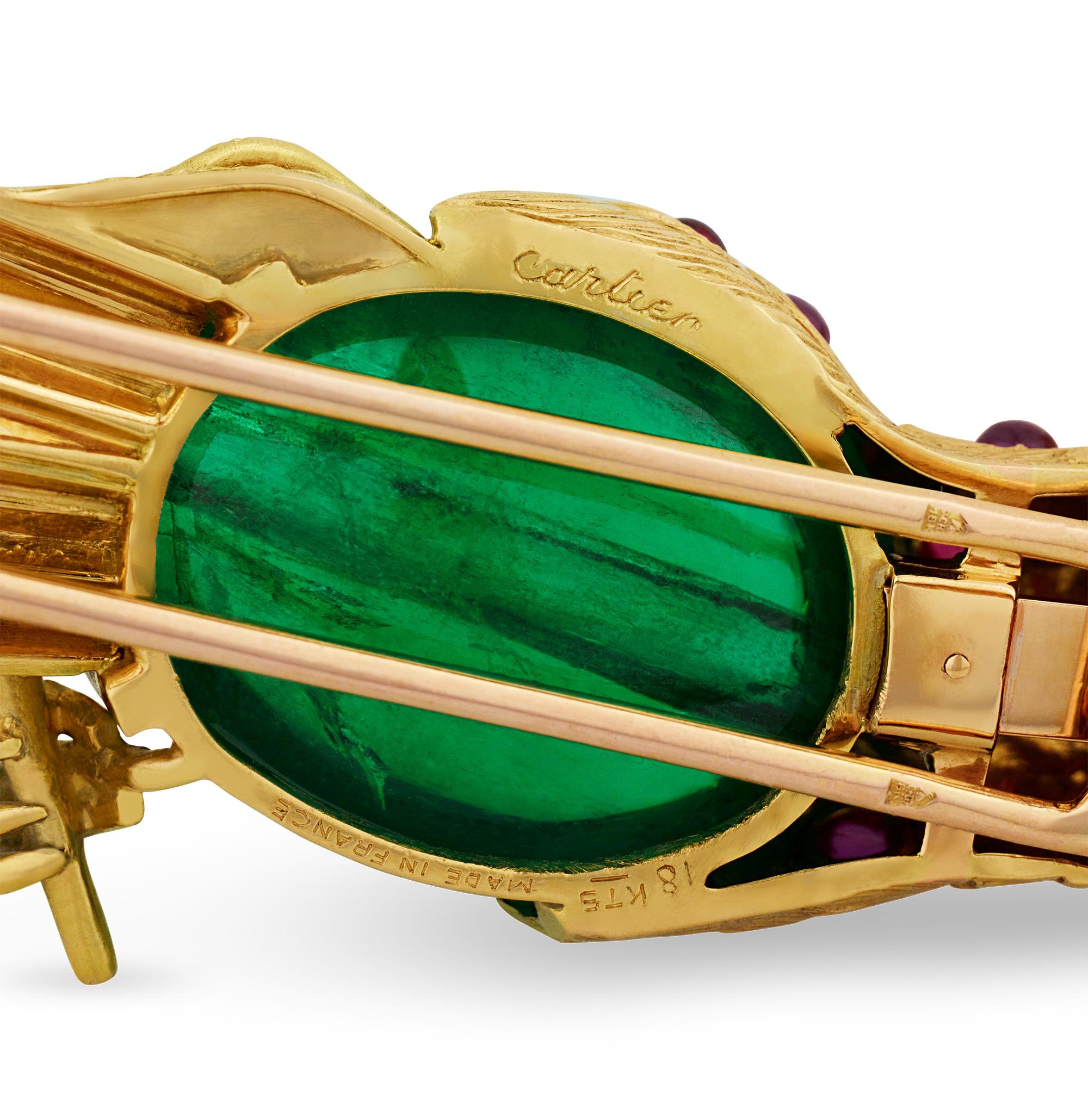This magnificent brooch, crafted by the esteemed house of Cartier, features a bird exquisitely formed from a rare and large emerald bead certified by the Gübelin Gem Lab as Colombian in origin and measuring 26.50mm by 18.00mm, weighing approximately