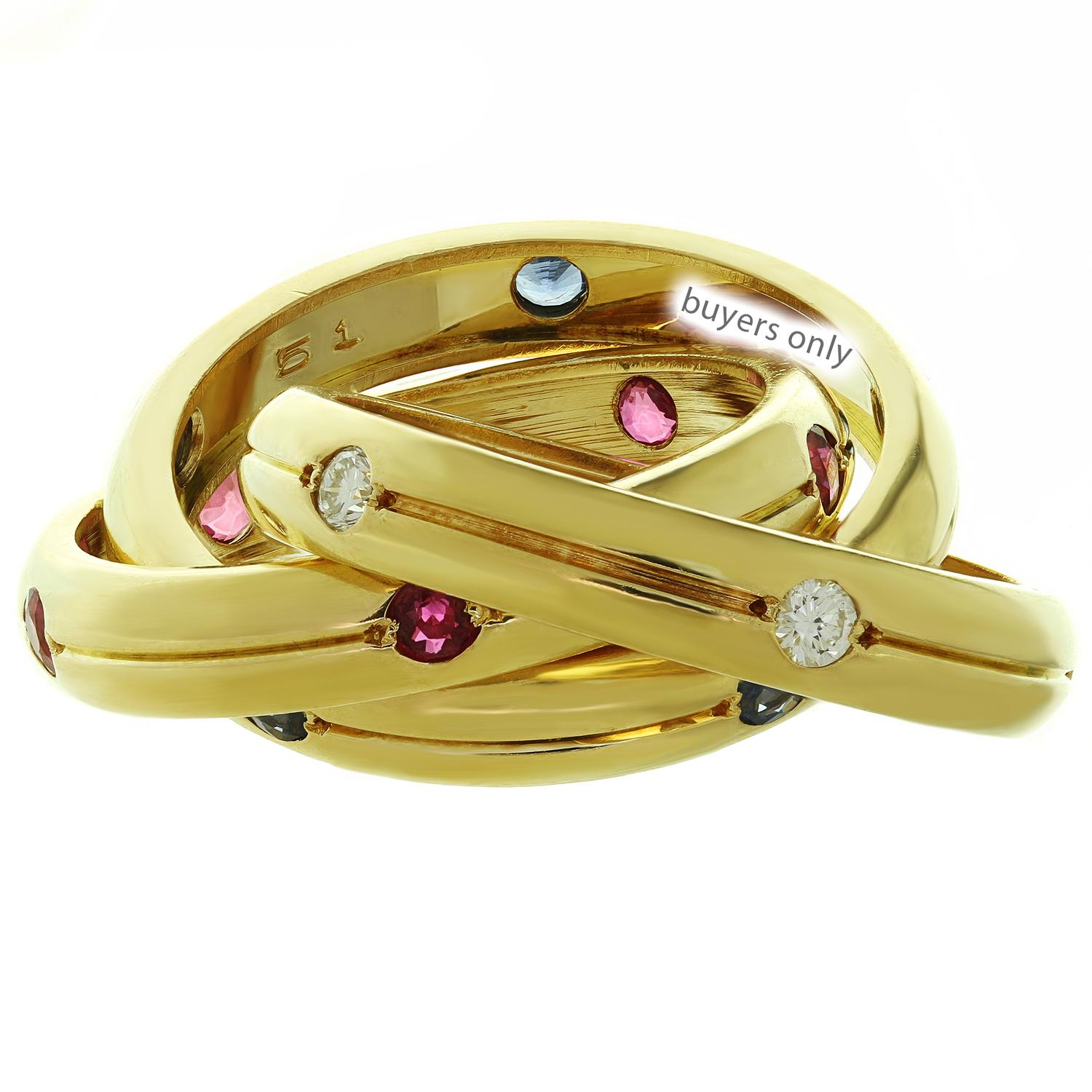 This gorgeous ring from Cartier's classic Constellation Trinity collection features 3 interwined 4.0mm bands crafted in 18k yellow gold and set with brilliant-cut round diamonds, red rubies and blue sapphires. Made in France circa 1990s.