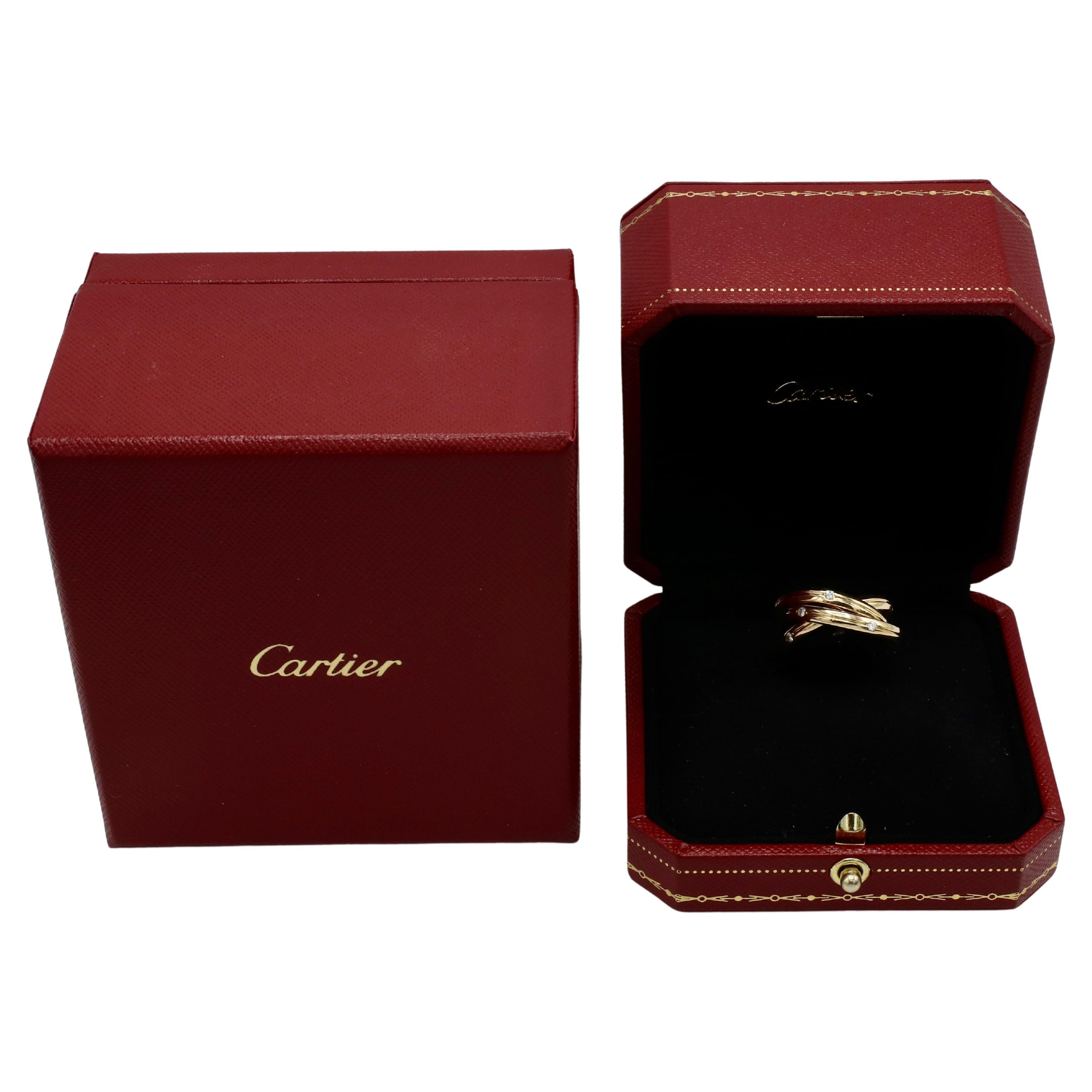 Cartier Constellation Vintage Natural Diamond & Yellow Gold Trinity Rolling Band Ring 
Metal: 18k yellow gold
Weight: 8.91 grams
Diamonds: Approx. 0.45 CTW E-F VS round natural diamonds
Size: 51 (5.75 US)
Bands: 3mm each
Signed: Cartier 750 849 380