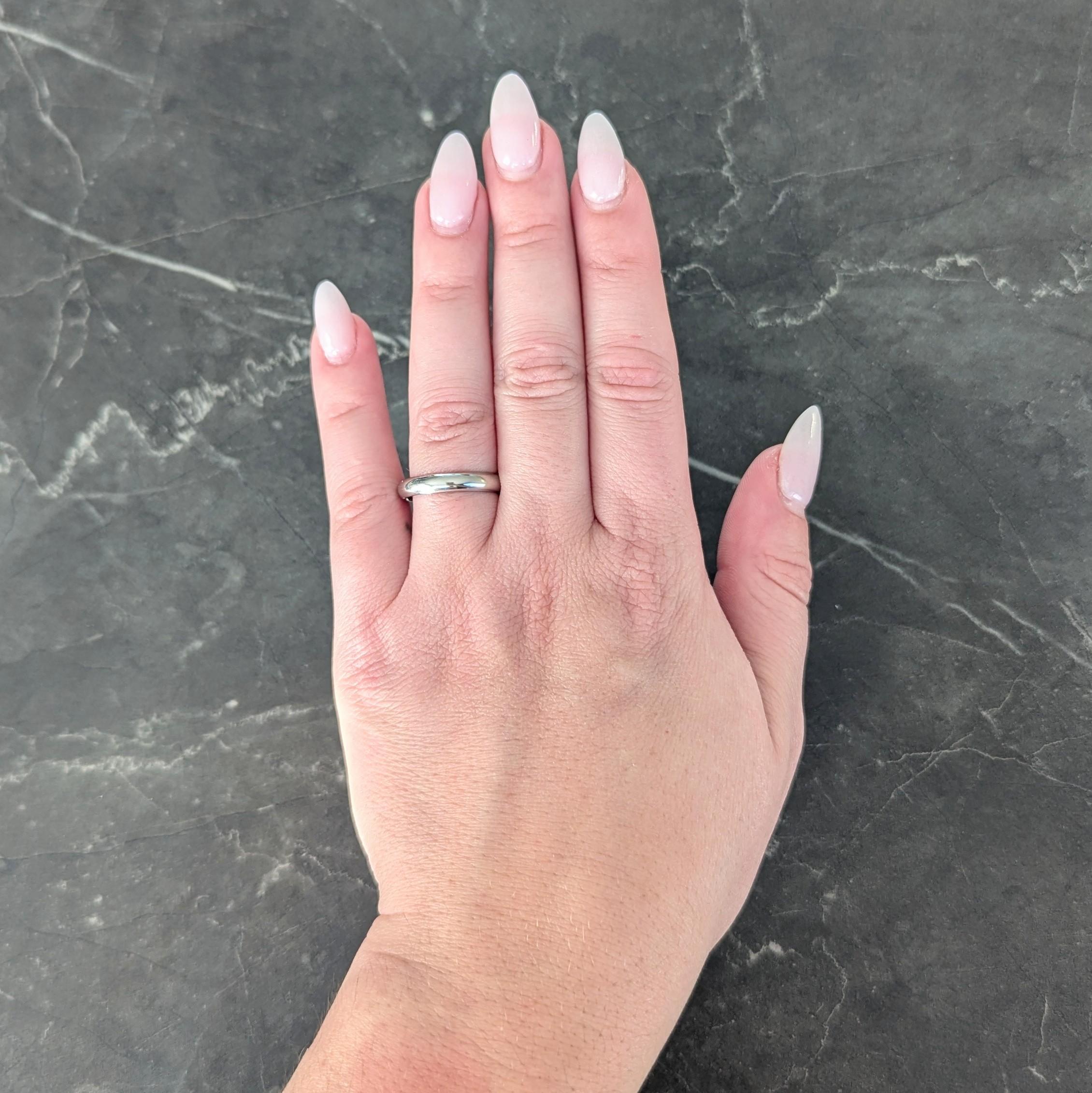 Designed as a rounded band ring
With high polish finish
Stamped for platinum
Numbered with maker's mark and fully signed for Cartier
Circa: 2000s; via 1895 collection
Ring Size: 6 3/4 and sizable - inscribed with EU ring size 54
Measures north to