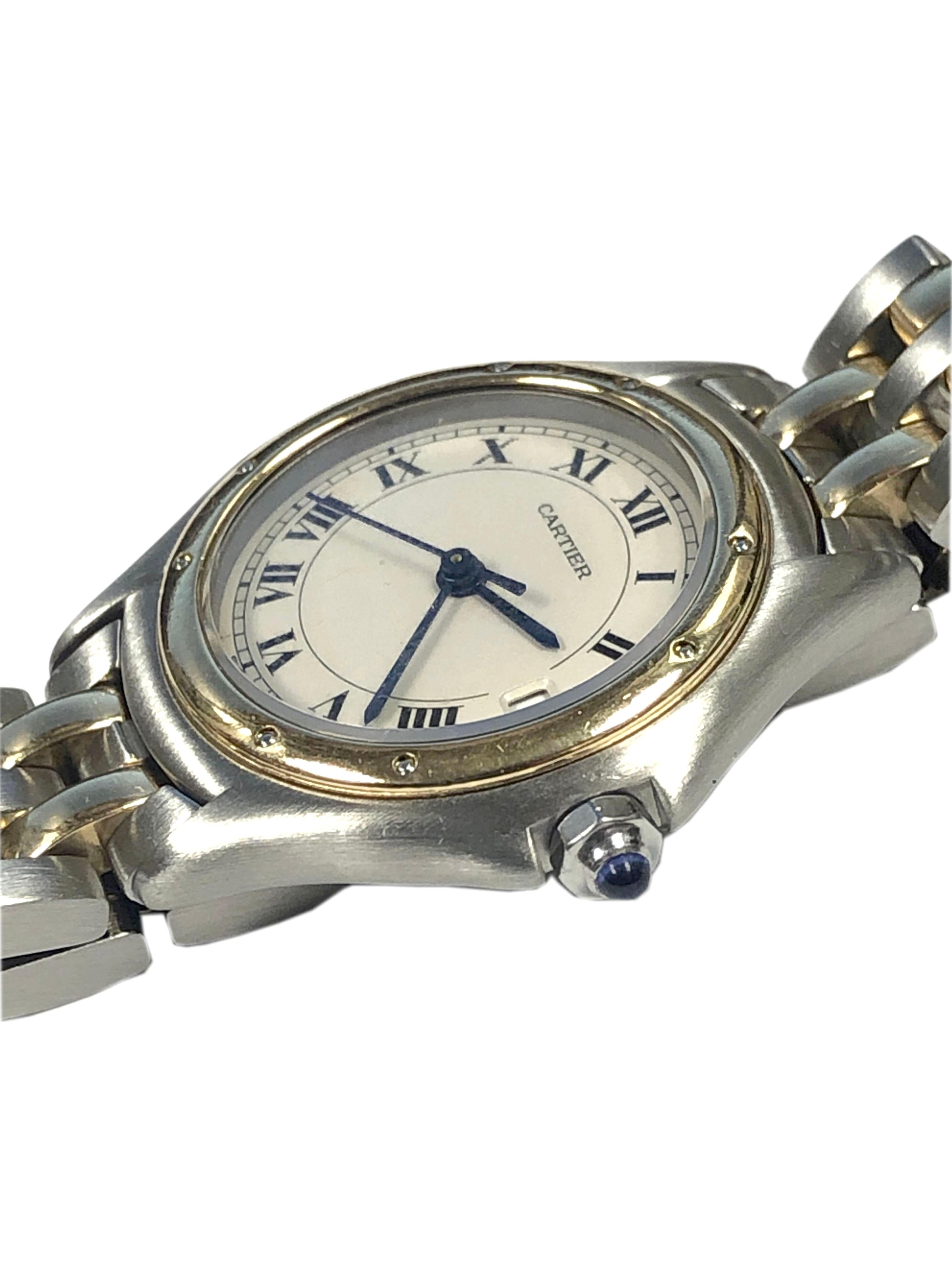 Circa 1990s Cartier Classic Ladies Cougar Wrist watch, 26 MM Stainless Steel case with 18k Yellow Gold Bezel and a Sapphire set Crown, quartz Movement, White Dial with Black roman Numerals, sweep seconds hand and a Calendar window at the 3 position.