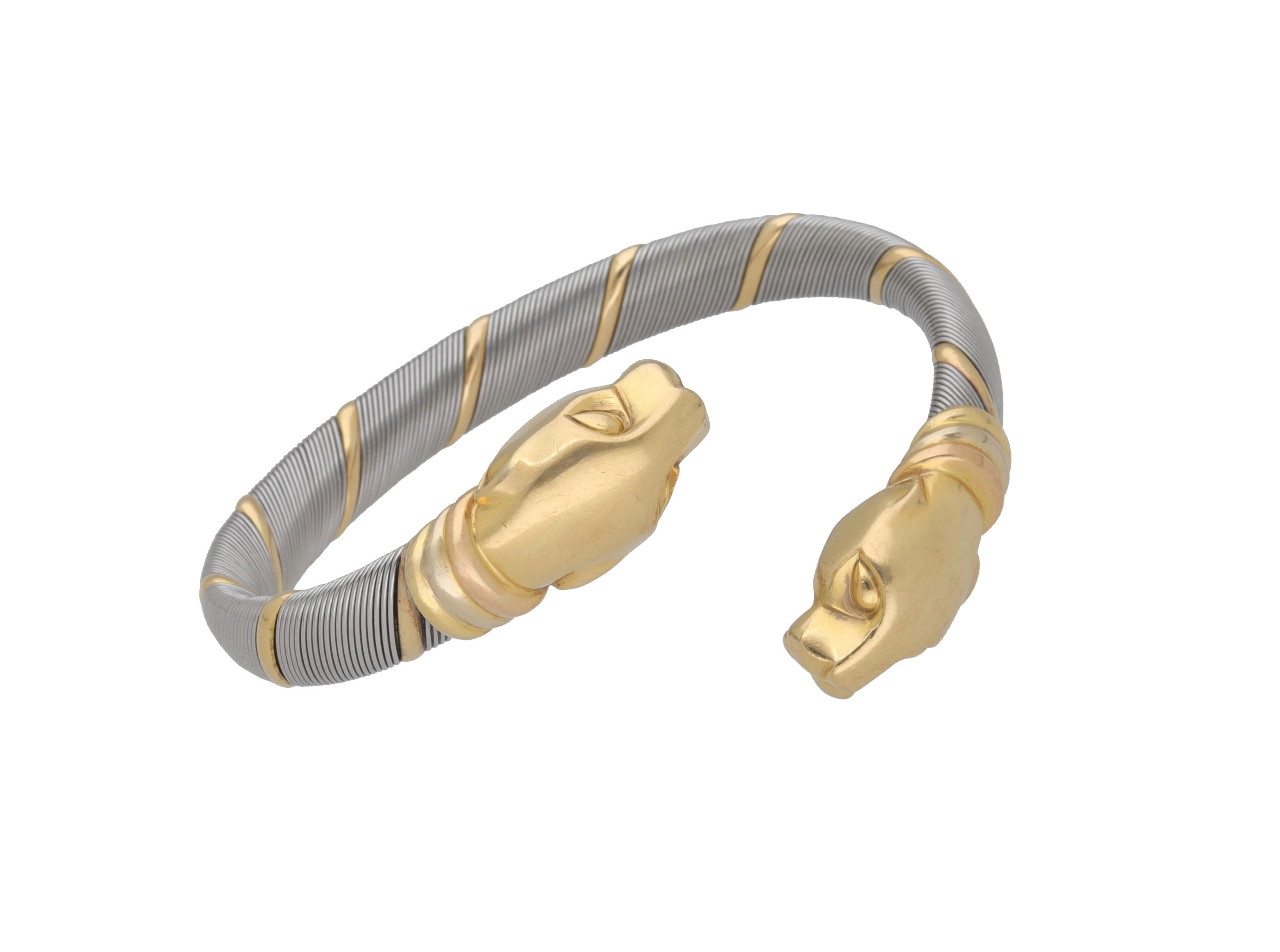 Bracelet en or jaune 18k et acier signé Cartier.
Cette magnifique pièce appartient à la collection Cougar Panthere de Cartier.
Les deux extrémités du bracelet représentent deux têtes de panthère, motif emblématique de la maison.
1990 ca.

Poids :