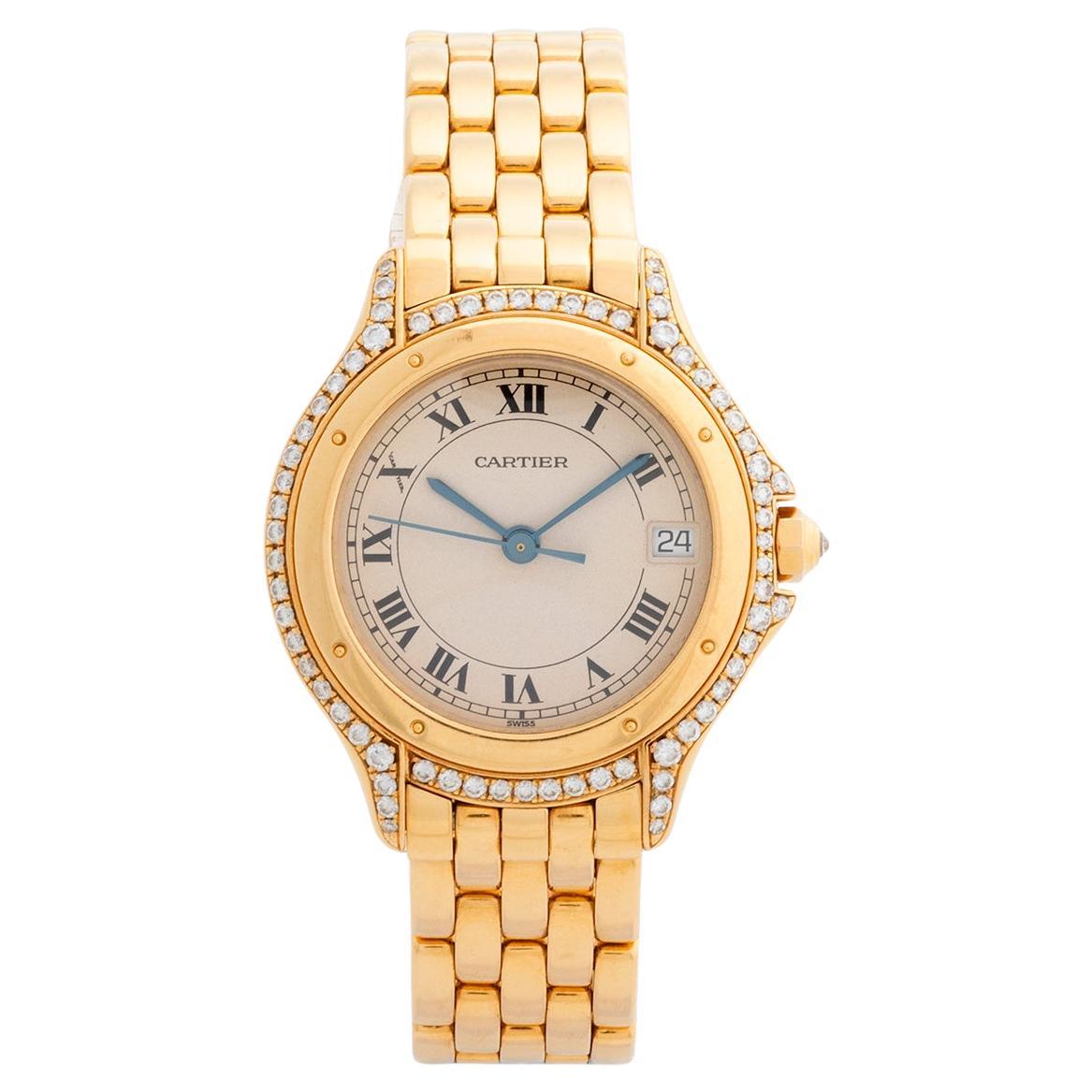 Our vintage and very attractive Cartier Cougar, reference 887907, features a 26mm yellow case with diamond bezel, and the desirable panthere 18k yellow gold bracelet. Presented in excellent condition with only light signs of use overall, this