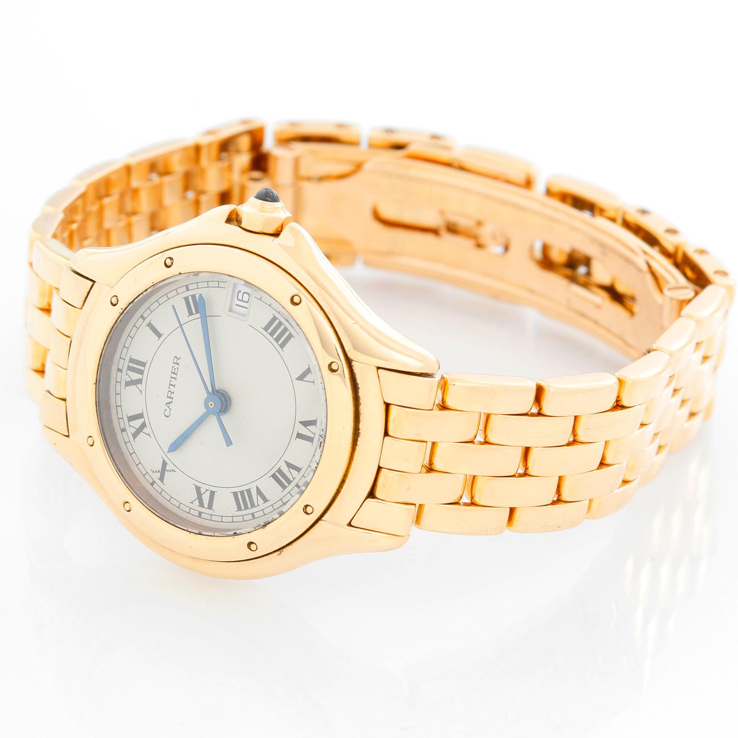 Cartier Cougar Yellow Gold  Ladies Quartz Watch - Quartz movement. Yellow gold case ( 26 mm ). Ivory colored dial with black Roman numerals; date at 3 o'clock. Yellow gold Panthere bracelet; will fit a 6 inch wrist . Pre-owned with Cartier box.