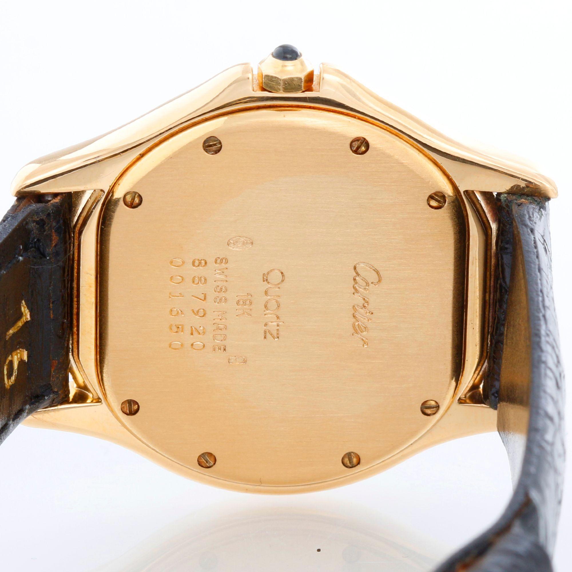 Cartier Cougar Yellow Gold  Ladies Quartz Watch - Quartz movement. Yellow gold case ( 33 mm ). Ivory colored dial with black Roman numerals; date at 3 o'clock. Black strap band with tang buckle . Pre-owned with custom box.