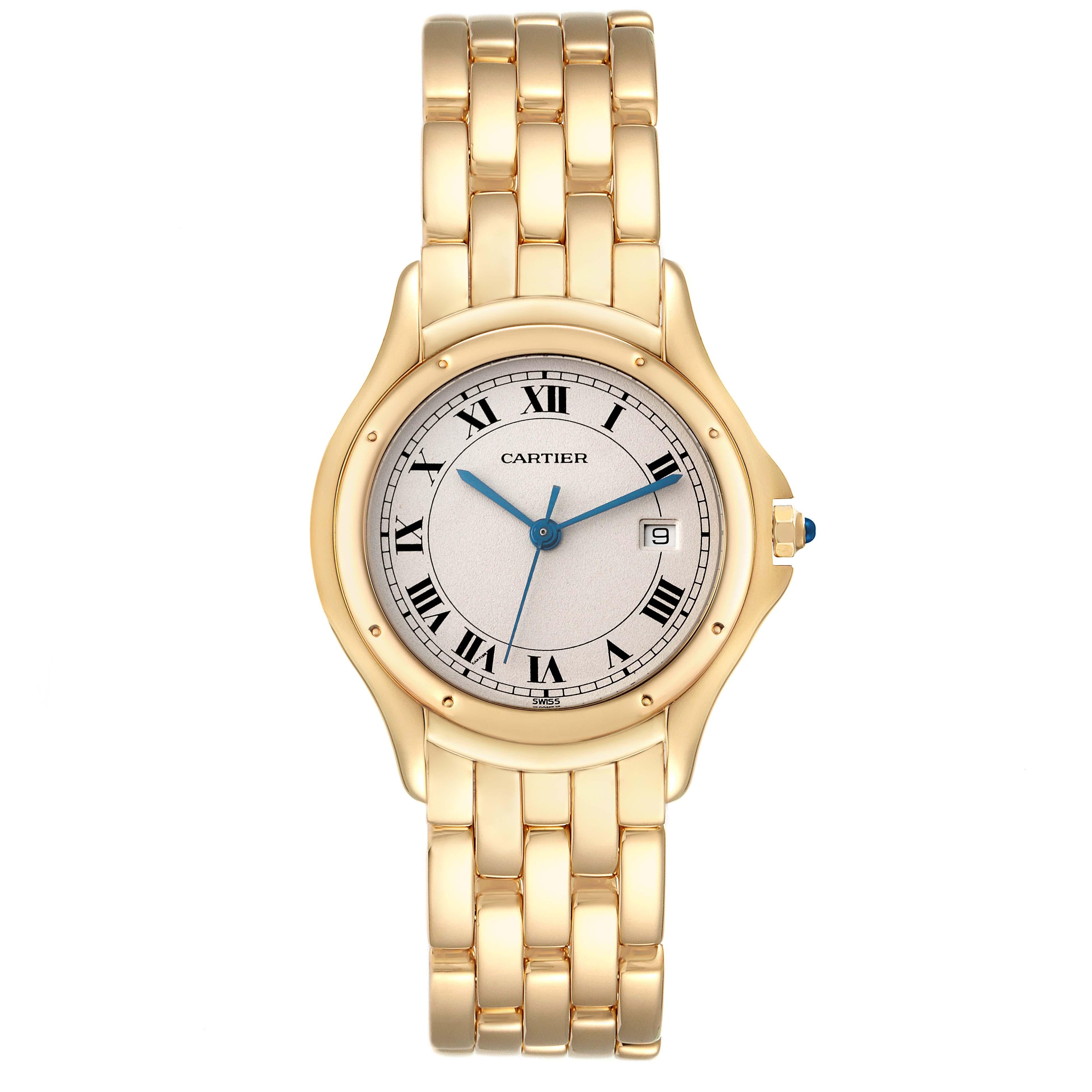 Cartier Cougar Yellow Gold Silver Dial Ladies Watch 887904. Quartz movement. 18k yellow gold round case 33 mm in diameter. Octagonal crown set with a blue sapphire cabochon. 18k yellow gold polished bezel, secured with 8 pins. Scratch resistant