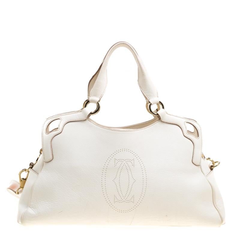 This Cartier beauty arrives in a gorgeous shape and design. It has a leather body with the logo detailed on the exterior and is held by two handles and a shoulder strap. The zipper secures the fabric interior and overall, the bag looks ready to lift