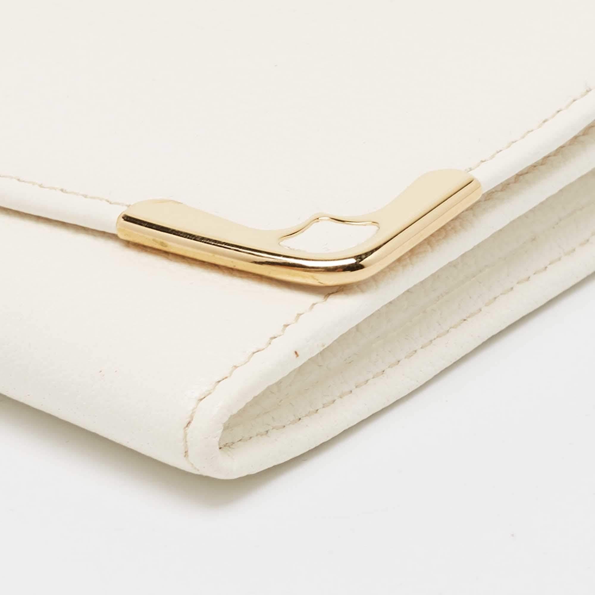 This Cartier beauty arrives in a gorgeous shape and design. It has a leather body with the logo detailed on the front flap. The flap secures the leather interior that houses multiple card slots and a zipped pocket.

Includes
Original Dustbag