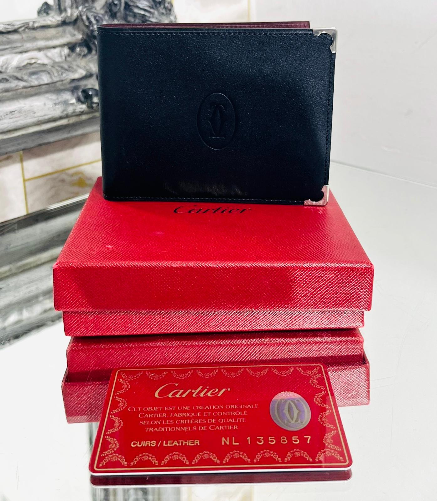 Cartier Credit Card Leather Wallet

Black wallet designed with iconic 'Double C' logo embossed to the centre.

Detailed with stainless-steel metalic finished corners.

Featuring burgundy leather interior with six card slots and banknote pocket. Rrp