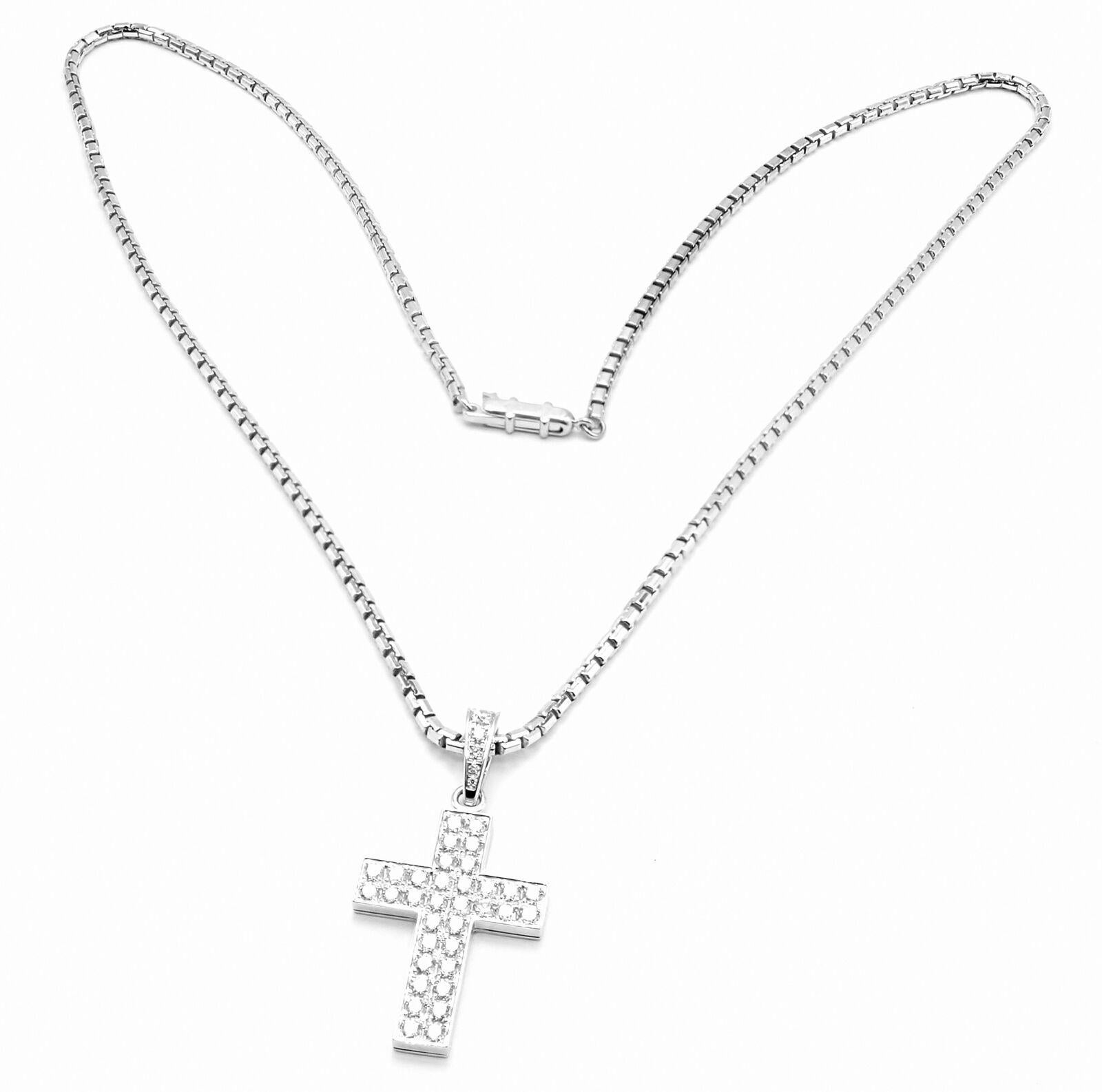 18k White Gold Diamond Cross Pendant Link Necklace by Cartier. 
With 42 round brilliant cut diamonds VVS1 clarity, E color total weight approximately 1.75ct
This necklace comes with service paper from Cartier store in NYC.
Details: 
Length: