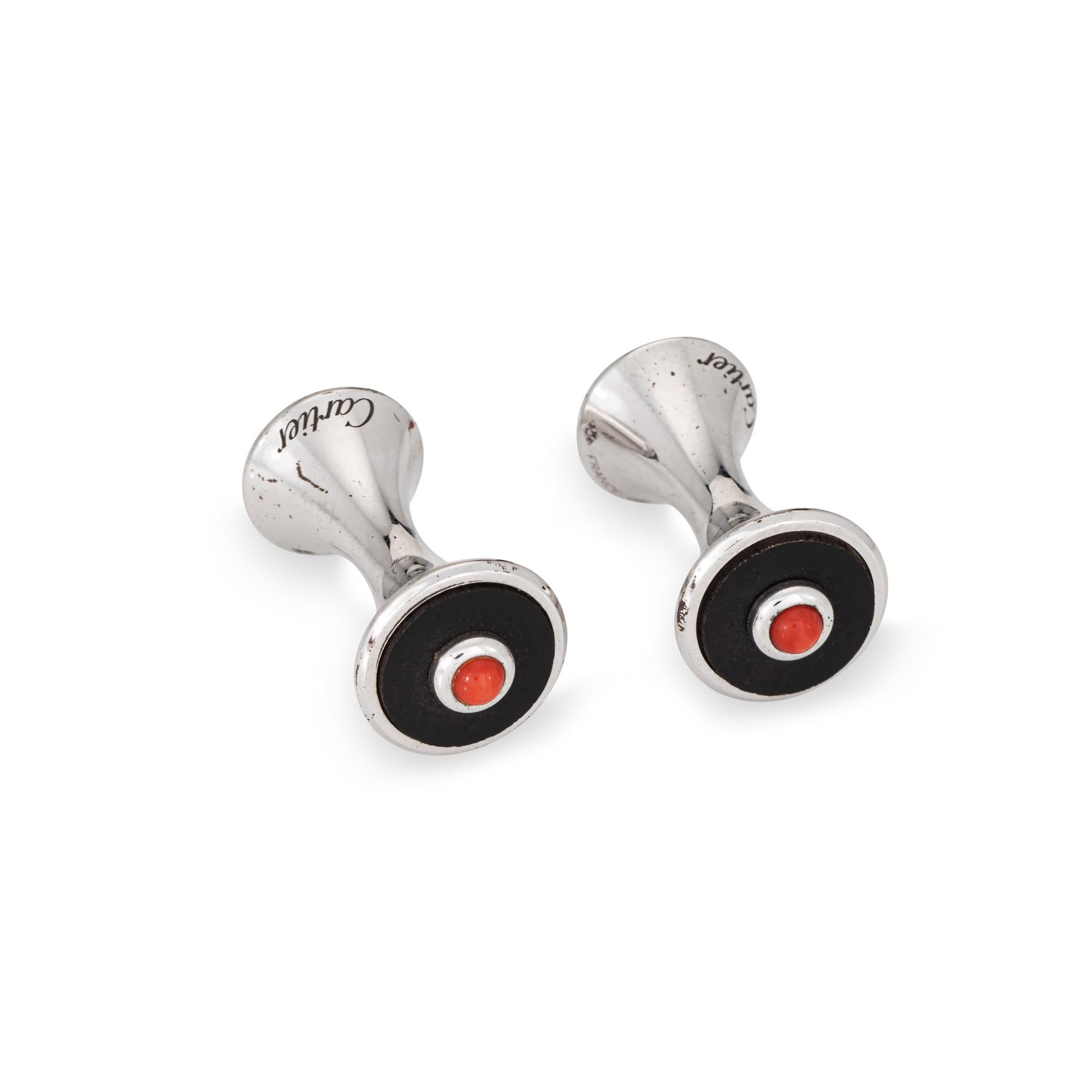 Estate Cartier coral & onyx cufflinks crafted in sterling silver.  

The stylish cufflinks feature coral and onyx set ends. Made in France the high-quality cufflinks would make a great gift to a special someone this holiday season. No Cartier box or