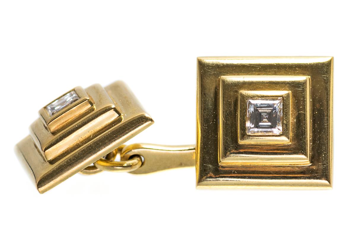 1960’s vintage Cartier double sided cufflinks in 18 karat yellow gold. Square in shape with a stepped design and a single square cut central diamond. Of heavy weight and signed CARTIER made in France. Numbered 2861 and stamped with the French eagle
