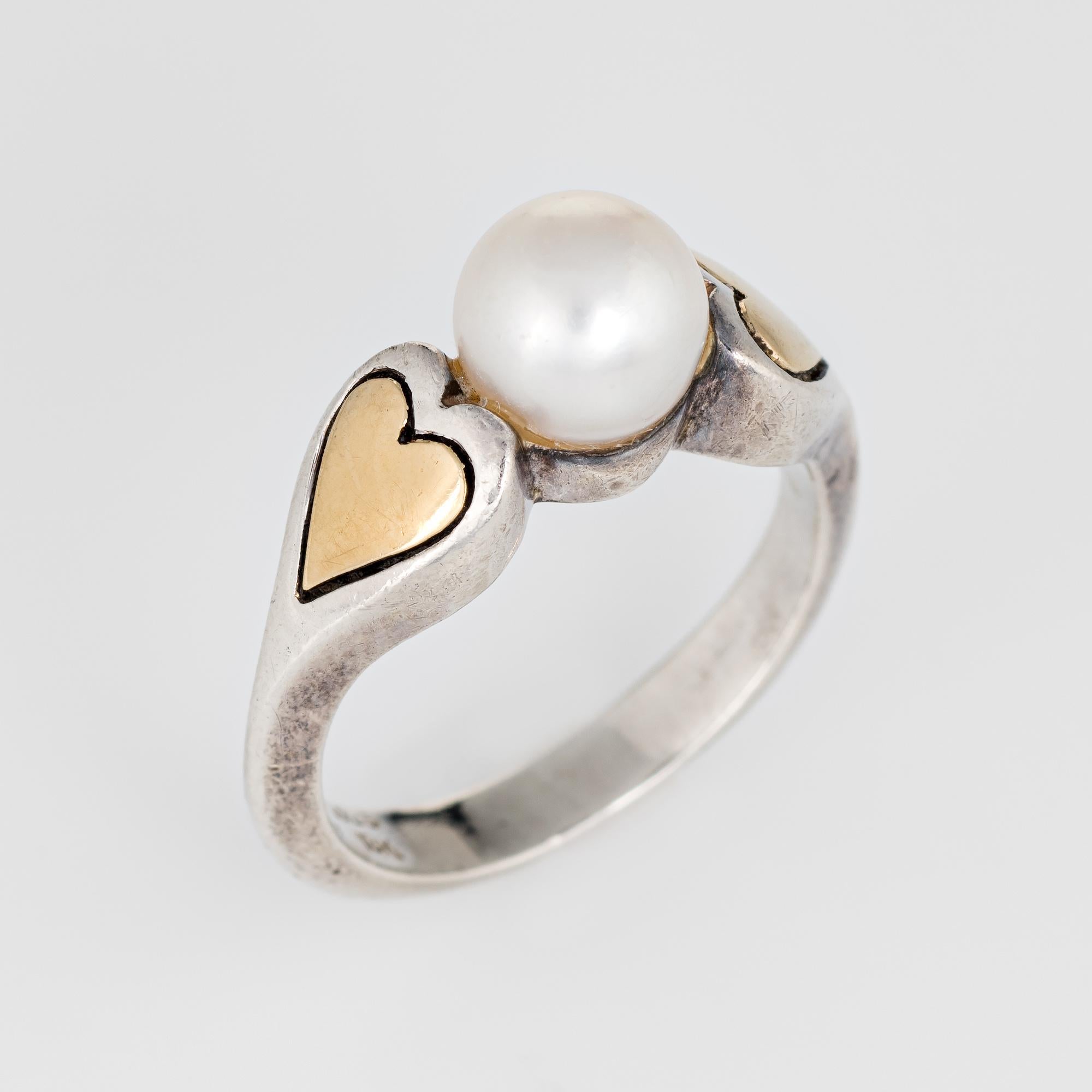 Vintage Cartier cultured pearl ring crafted in sterling silver & 18k yellow gold (circa 1960s).  

The ring is set with a 6.8mm cultured pearl. The pearl is in excellent condition and free of cracks or chips. 

The ring is in very good condition. We