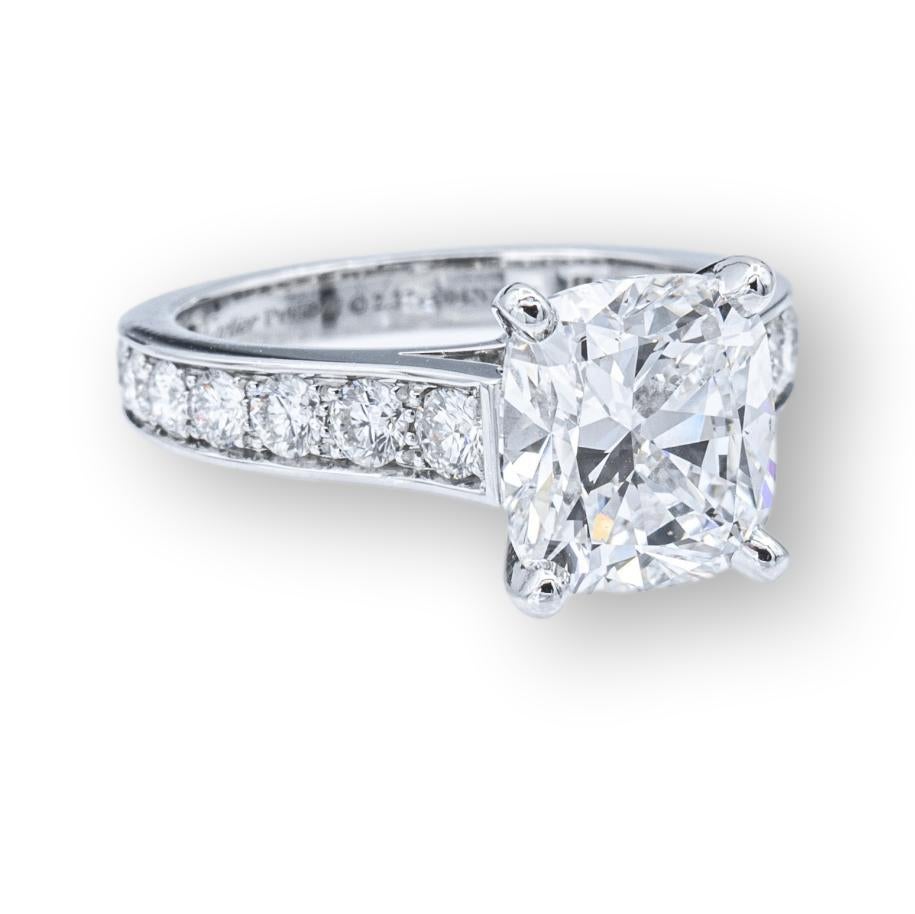Cartier engagement ring from the 1895 Paved Solitaire collection finely crafted in platinum featuring a 2.37 carat cushion brilliant diamond center set in 4 prongs on top of a paved diamond setting with 18 round brilliant cut diamonds weighing 0.54