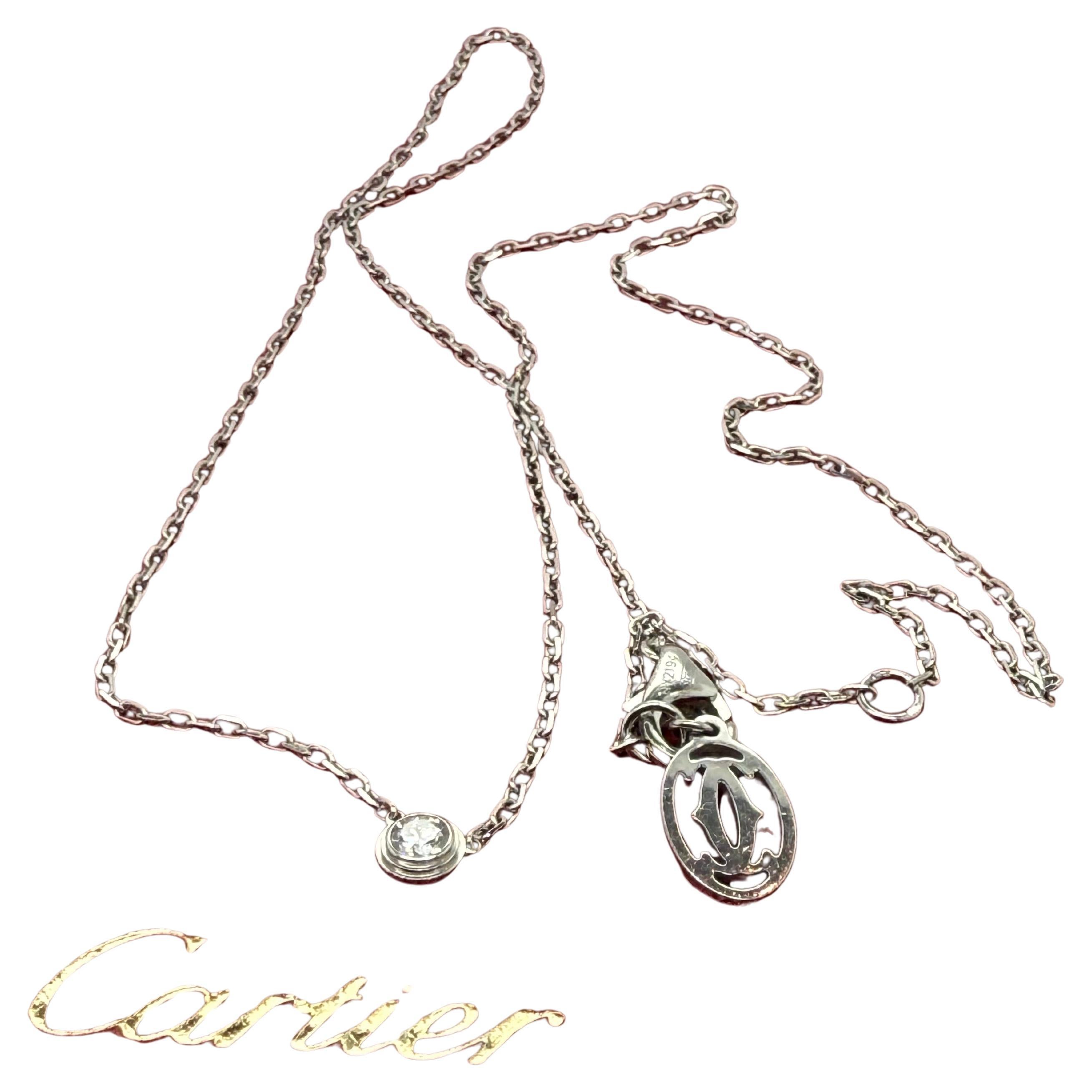 Cartier D'Amour diamond pendant necklace crafted in 18-carat white gold. A single, brilliant-cut diamond, weighing approximately 0.09 carats, is elegantly showcased in a stepped collet setting. The pendant is suspended from a classic belcher link