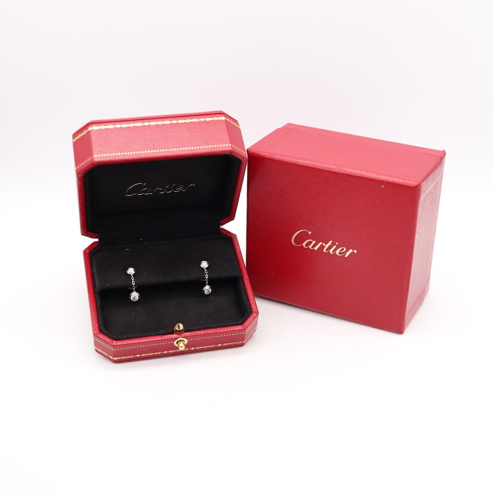 D'Amour dangle drop earrings designed by Cartier.

Beautiful contemporary dangle drop earrings, created in Paris France by the jewelry house of Cartier. They are from d'amour collection and was crafted in solid white gold of 18 karats with high