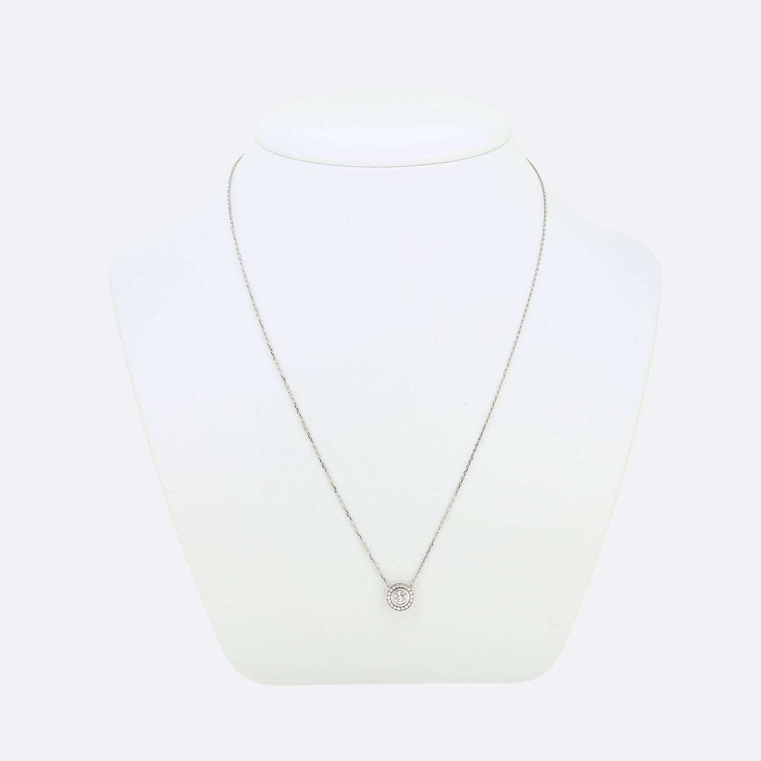 Here we have a fabulous necklace from the world renowned jewellery house of Cartier. This piece forms part of their iconic 'D'amour' collection and features a single 0.25ct round brilliant cut diamond surrounded by a halo of smaller matching stones
