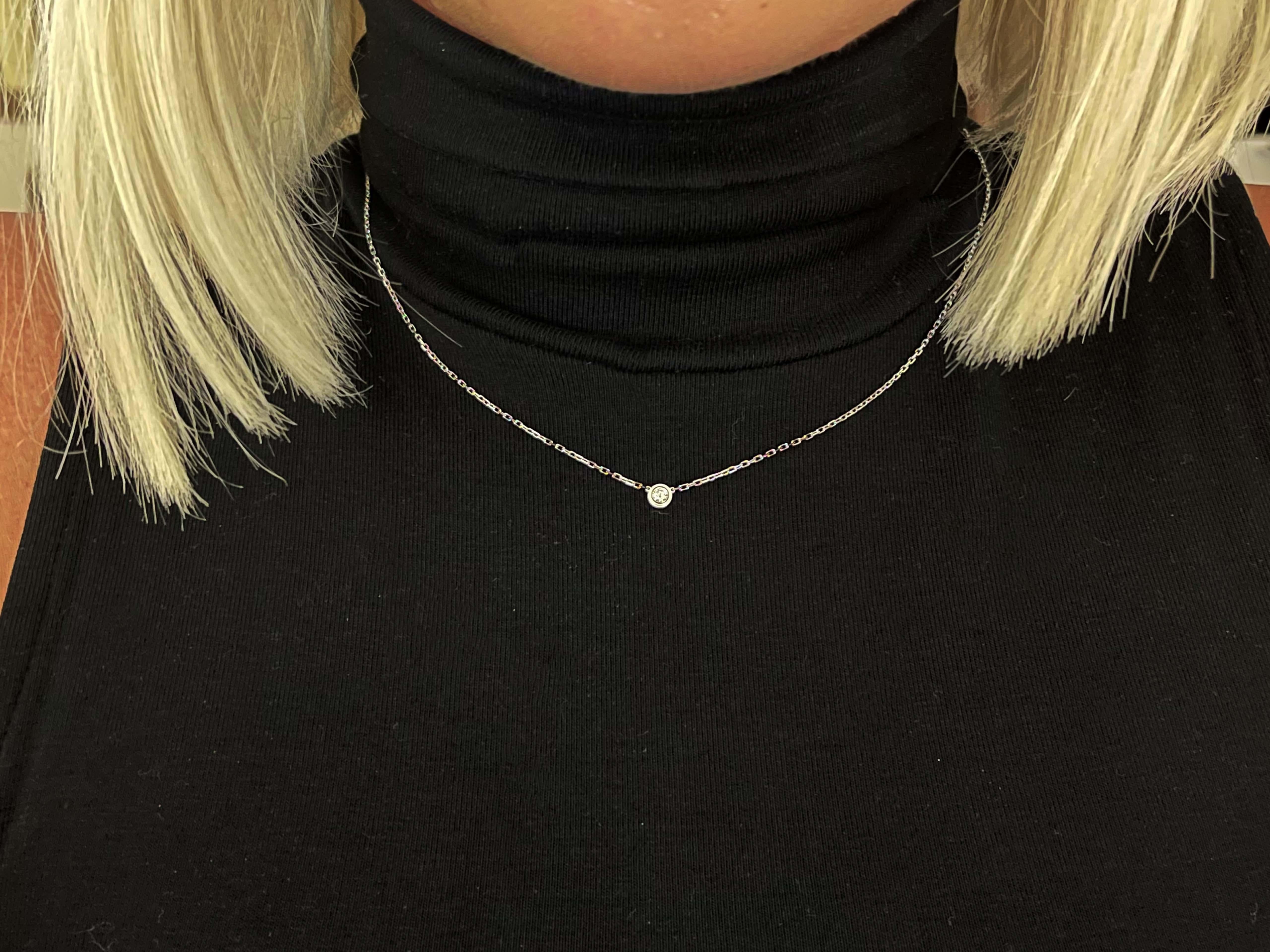 Cartier d'Amour necklace, small model, 18K white gold, set with a brilliant-cut diamond totaling 0.09 carat. Diameter of the pattern: 4.5 mm. The diamond is D-F in color, VS in clarity. Comes on a 14