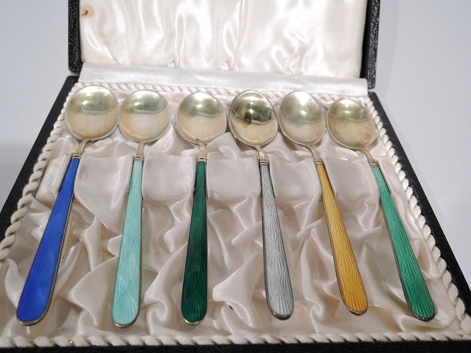 Set of 6 Danish Mid-Century Modern gilt sterling silver and enamel demitasse spoons. Retailed by Cartier in New York. Each tapering shaft with double-sided enamel in imbricated leaf pattern. Bowl oval with same on verso. Each color different. In