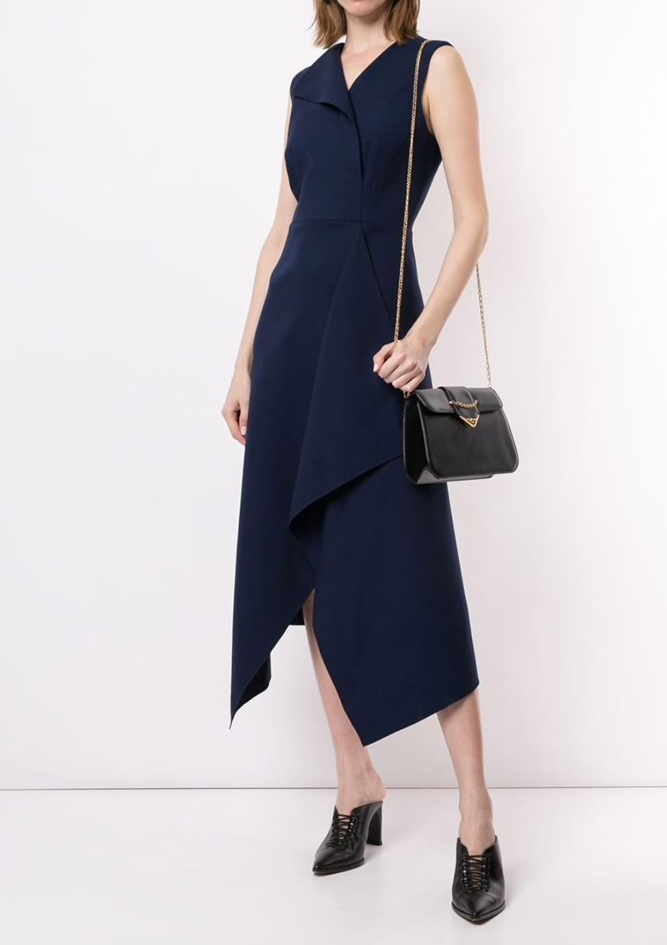Cartier Dark Midnight Blue Leather Gold Emblem Envelope Evening Chain Shoulder Flap Bag

Leather
Gold tone hardware
Snap closure
Woven lining
Made in France
Measures 8.25