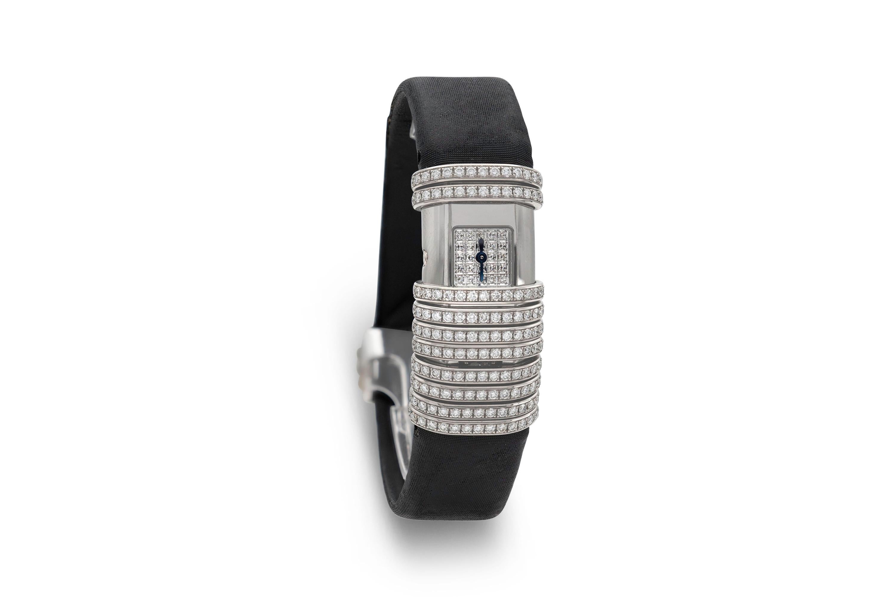 Finely crafted in 18k white gold and titanium.
The watch face features diamonds. 16mm
The watch features a 0.60 carat round brilliant cut diamond.
Swiss-made watch, water-resistant
Signed and numbered by Cartier