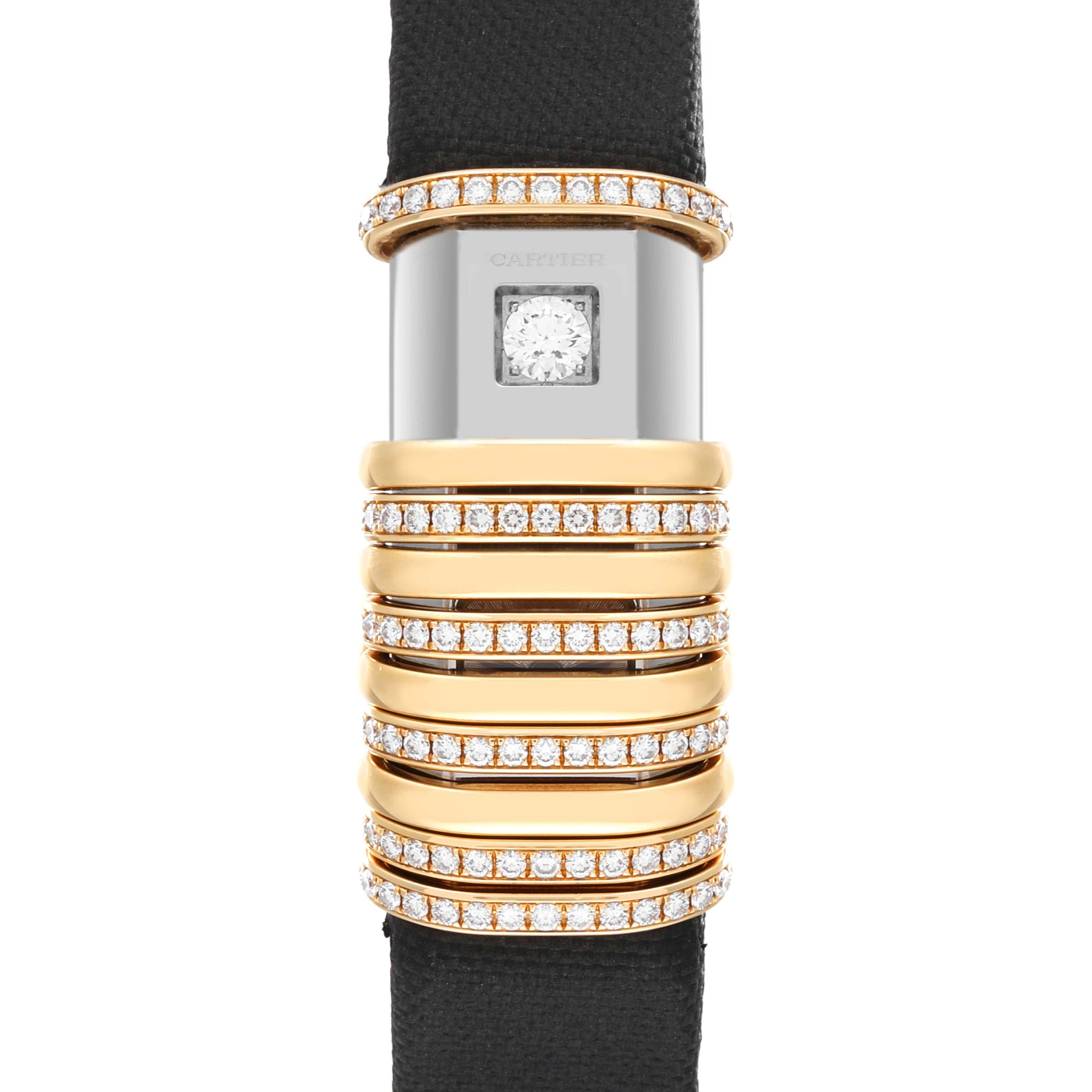 Cartier Declaration Yellow Gold Titanium Diamond Ladies Watch WT000150. Quartz movement. Elongated curved titanium case 18 mm x 39 mm. Ten 18k yellow gold mobile sliding bands moving freely along its length to reveal the dial or round brilliant cut