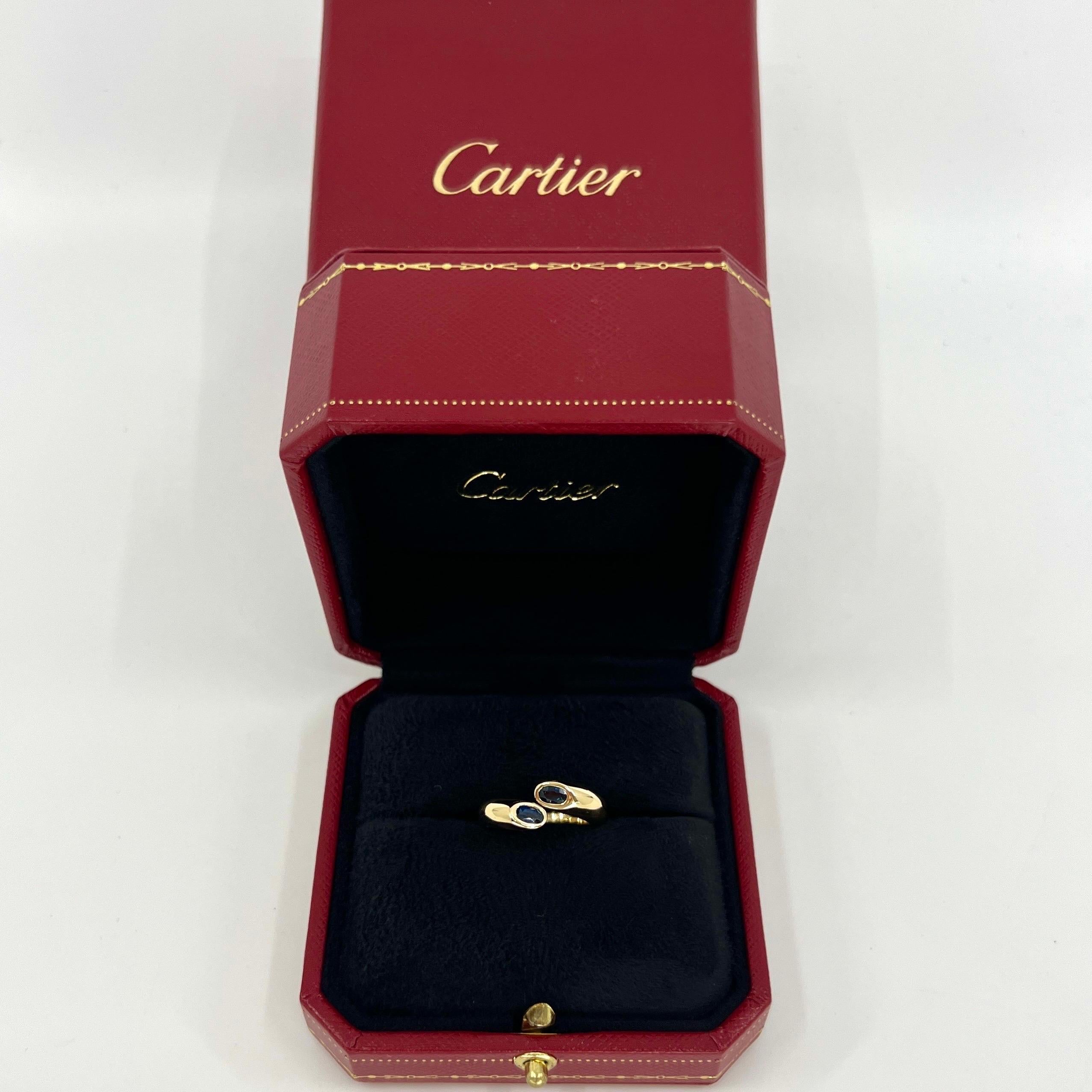 Rare Vintage Cartier Deep Blue Sapphire 18k Yellow Gold Bypass Ring.

Stunning yellow gold ring set with 2 fine deep blue oval cut sapphires. Fine jewellery houses like Cartier only use the finest of gemstones in their jewellery and these sapphires