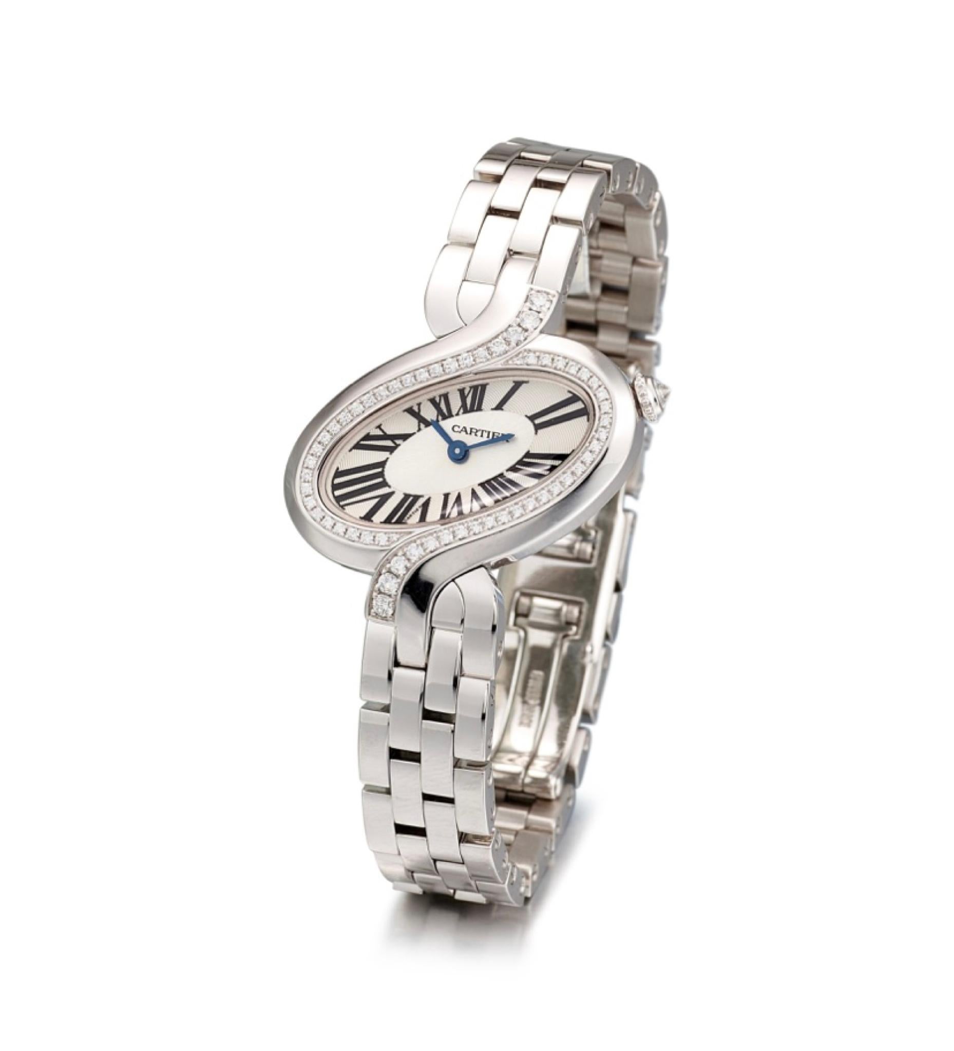 Elegant and seldom seen Cartier Delices de Cartier reference 3383 cased in 18K white gold and adorned with diamonds. 

Case material: 18k white gold and diamond-set
Diameter: 31 x 20 mm. (W x L)
Bracelet material: 18k white gold Cartier