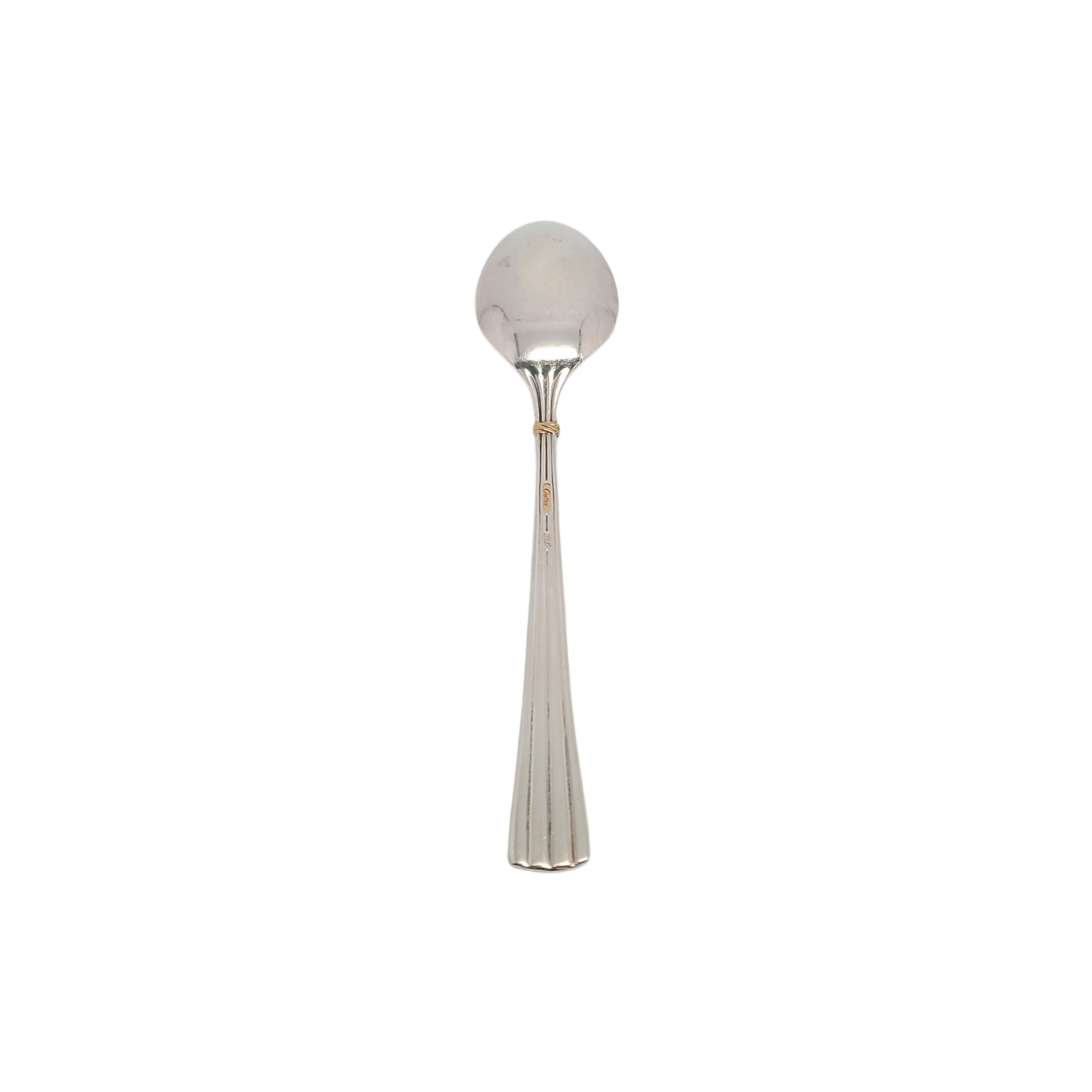 Vintage sterling silver demitasse spoon by Cartier.

No monogram.

Cartier's Des Must pattern features a simple and timeless ribbed design with a small gold accent.

Measures 4 3/8