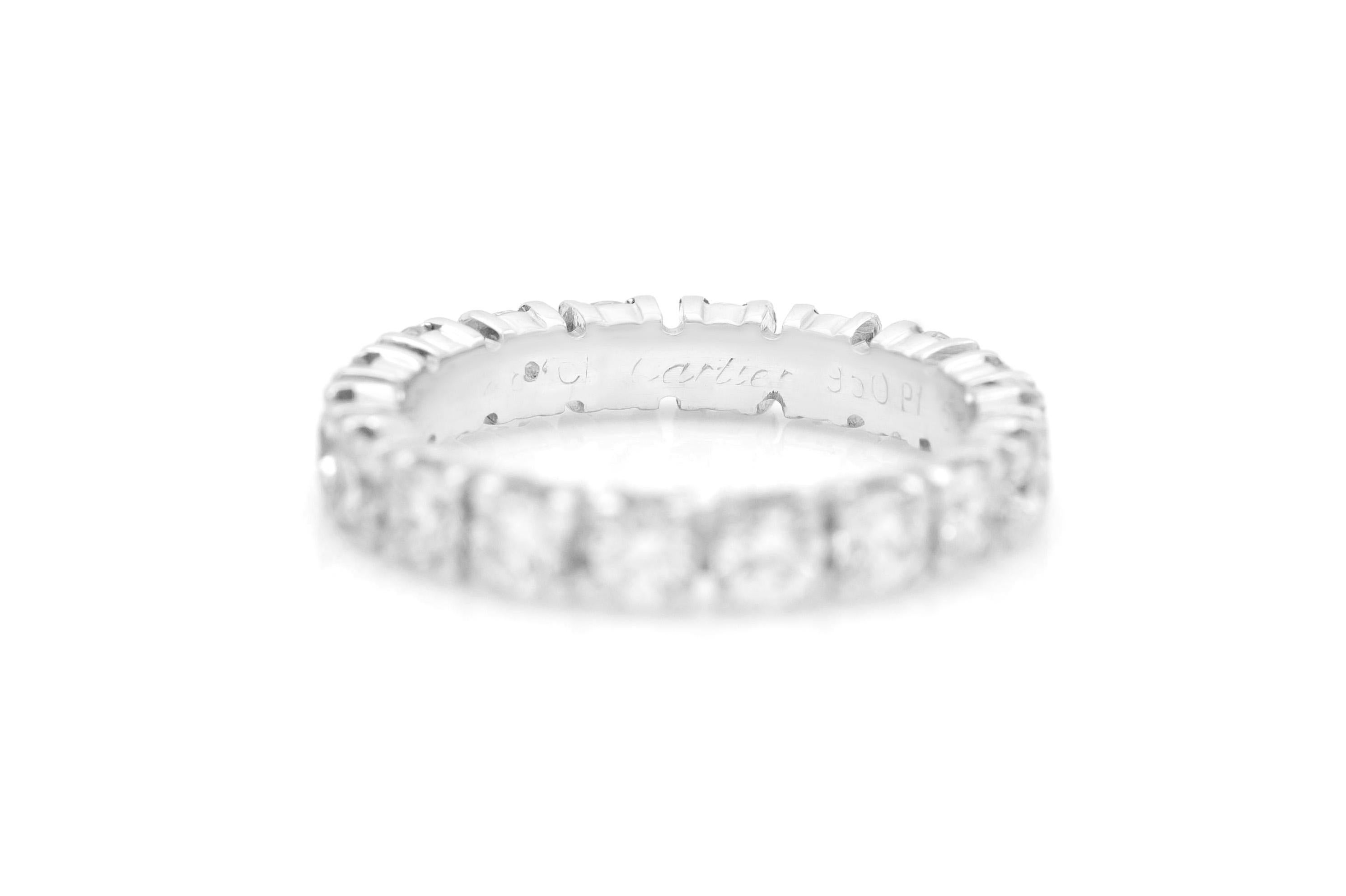 Finely crafted in platinum with 18 Round Brilliant cut Diamonds weighing a total of approximately 1.80 carats. 
Signed by Cartier
Size 5 3/4