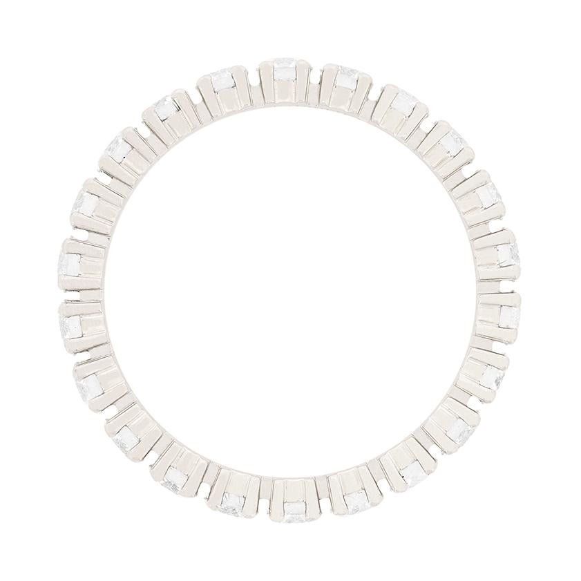 Cartier's 'Destinée' collection full eternity diamond band is a classic. There are 22 claw-set diamonds, totalling to 1.56 carats, set in the platinum band. The round brilliant cut diamonds are G colour and VVS clarity. The original Cartier
