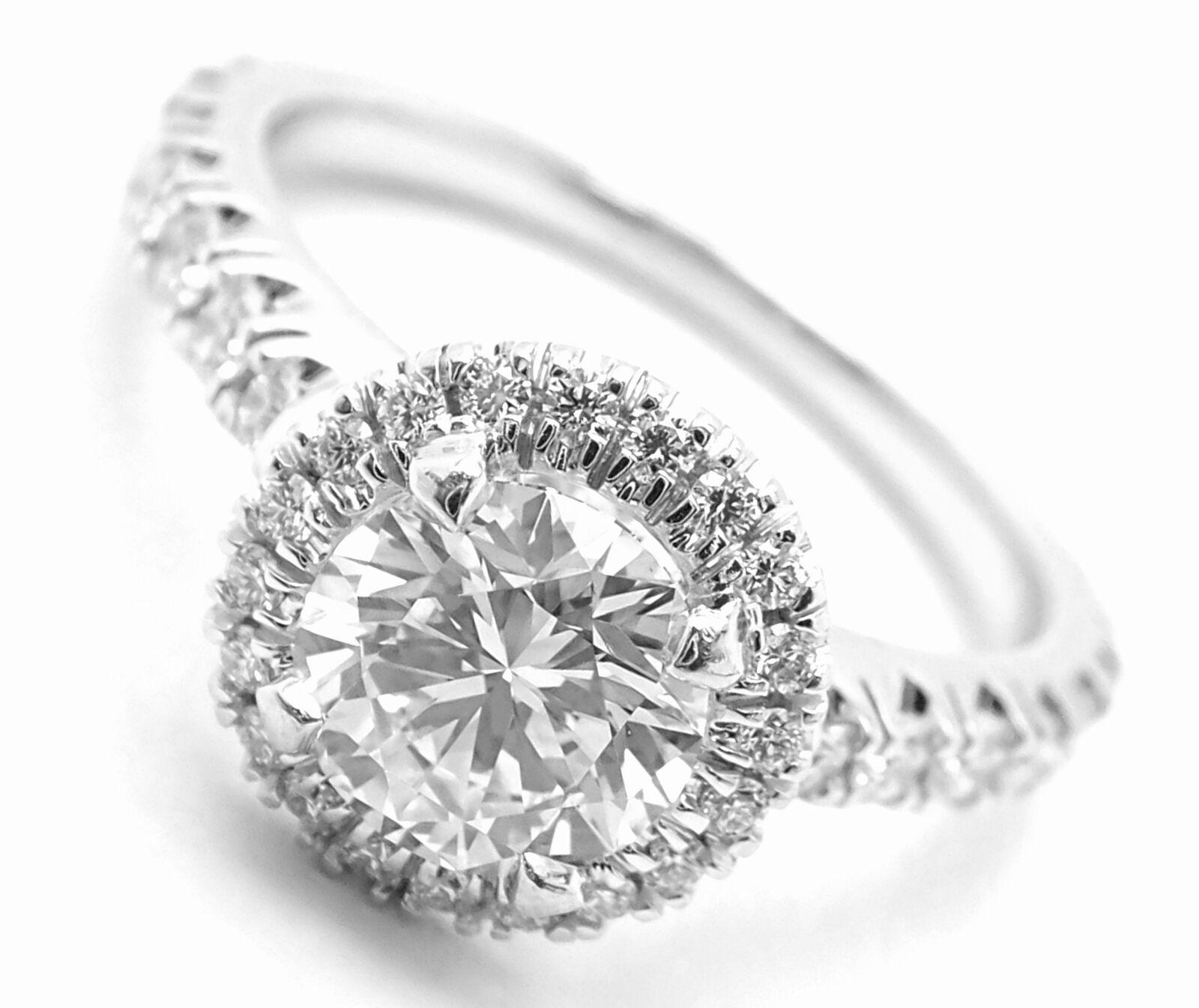 Platinum Diamond Destinee Engagement Solitaire Ring by Cartier. 
With 1 round brilliant cut diamonds VS2 clarity, D color total weight approx. .72ct
39 small round brilliant cut diamonds VS1 clarity, E color total weight approximately .40ct
This