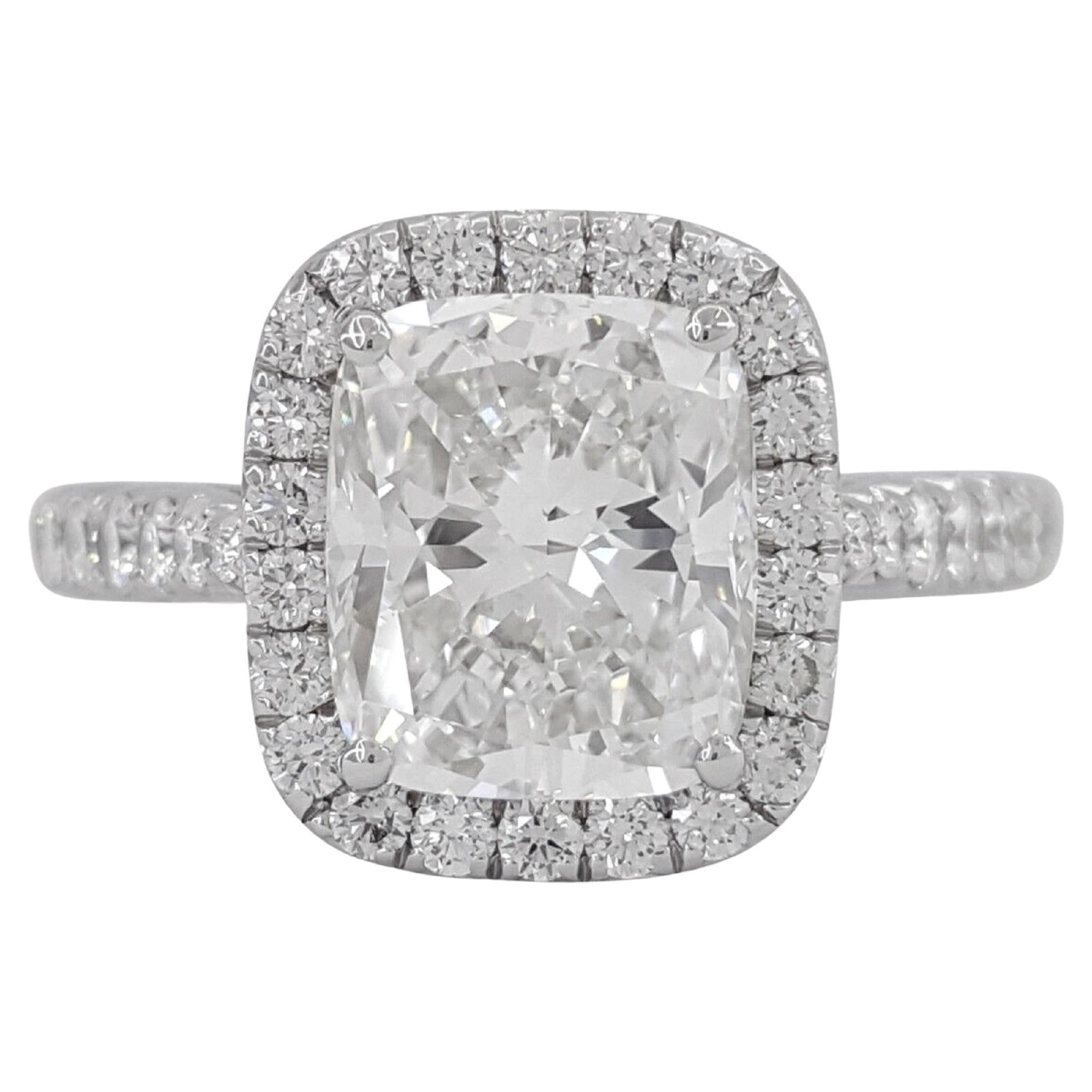 Cartier DESTINÉE Solitaire Platinum Cushion Cut Diamond Halo Engagement Ring.

The ring weighs 5.5 grams, size 5.25 (French 50), the center stone is a Natural Elongated Cushion Brilliant Cut diamond weighing 2.01 ct, F in color, VVS2 in clarity,