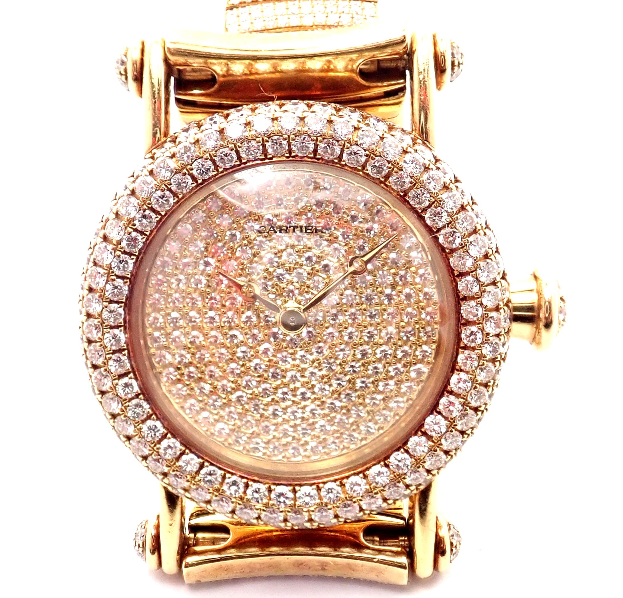 18k Yellow Gold 15ct Pave Diamond Diabolo Wristwatch by Cartier 1450.
With Round Brilliant Cut Diamonds VS1 clarity, E color total weight approximately 15ct
Brand: Cartier
Style Number: Diabolo 1450
Case Material: 18k Yellow Gold with Diamonds
Dial