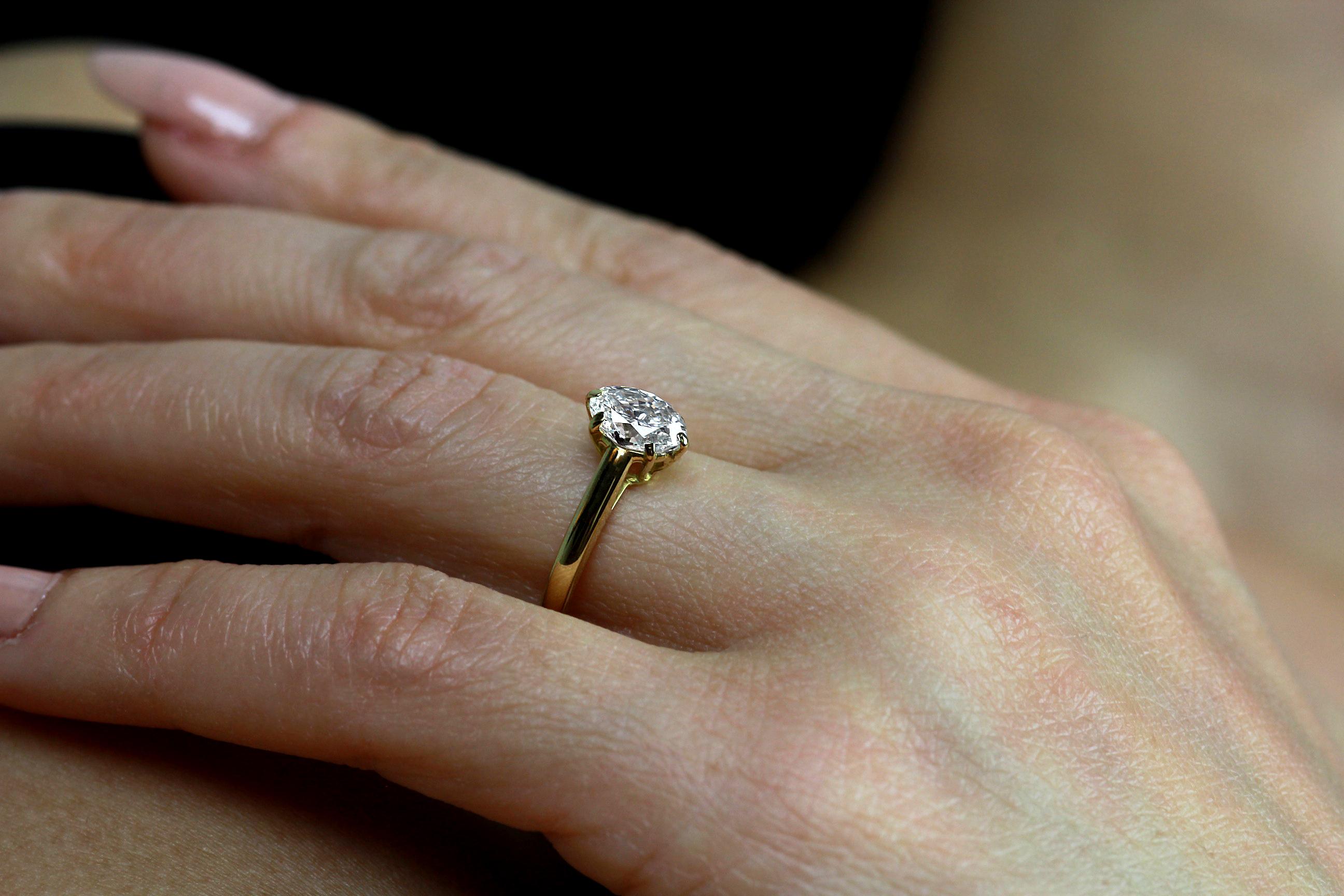 Modern Cartier Diamond, Oval Shape Engagement Ring set in British Hallmarked 18K Gold