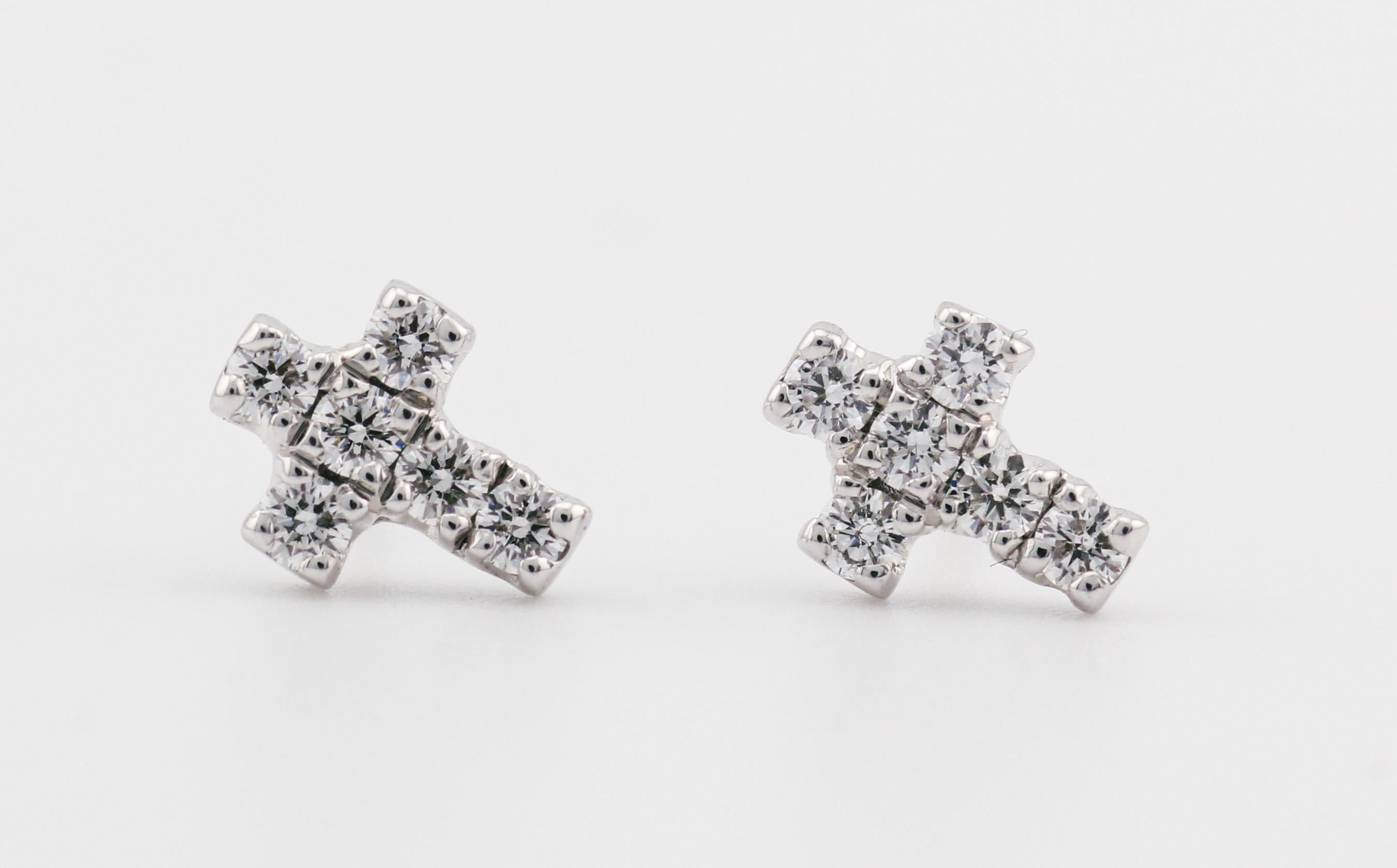 The Cartier Diamond 18 Karat White Gold Cross Stud Earrings are a sublime fusion of religious symbolism and high-end luxury craftsmanship, brought to life by the esteemed house of Cartier. These earrings exude an understated elegance that speaks