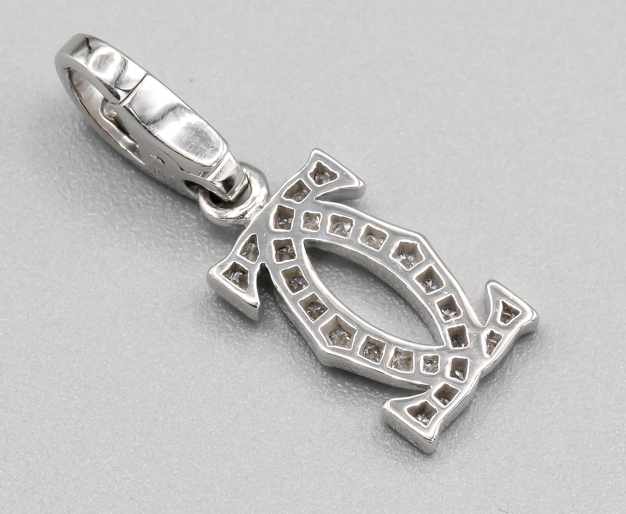 Fine diamond and 18K white gold charm by Cartier. Designed as the interlocking double C Cartier logo, featuring high grade round brilliant cut diamonds. Well made and easy to add to any bracelet or pendant. 

Hallmarks: Cartier, 750 reference