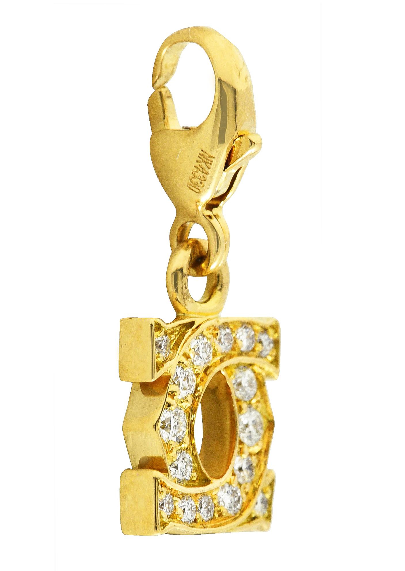 Charm is designed as Cartier's iconic double C logo

Bead set with round brilliant cut diamonds

Weighing in total approximately 0.25 carat with F/G color and VS clarity

Completed by a lobster clasp

Clasp is stamped 750 for 18 karat gold

Numbered
