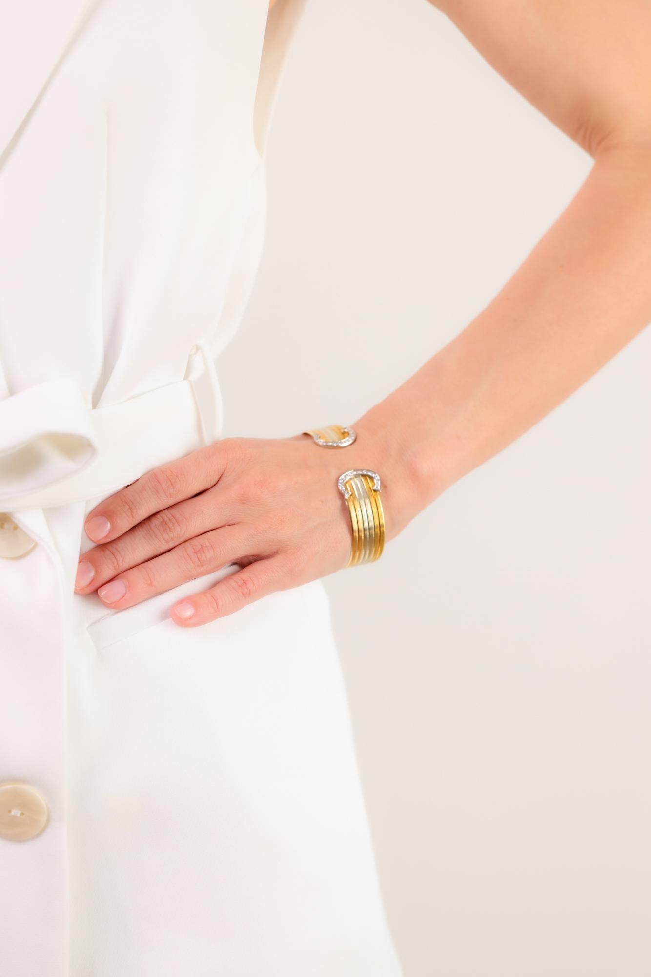 This vintage Cartier Trinity cuff bracelet dazzles with 0.60 carats of sparkling diamonds, crafted in elegant 18k yellow, white, and rose gold.

Brand: Cartier
Center stone: 34 single cut diamonds 
Weight: Approximately .60 carats
Color: G
Clarity:
