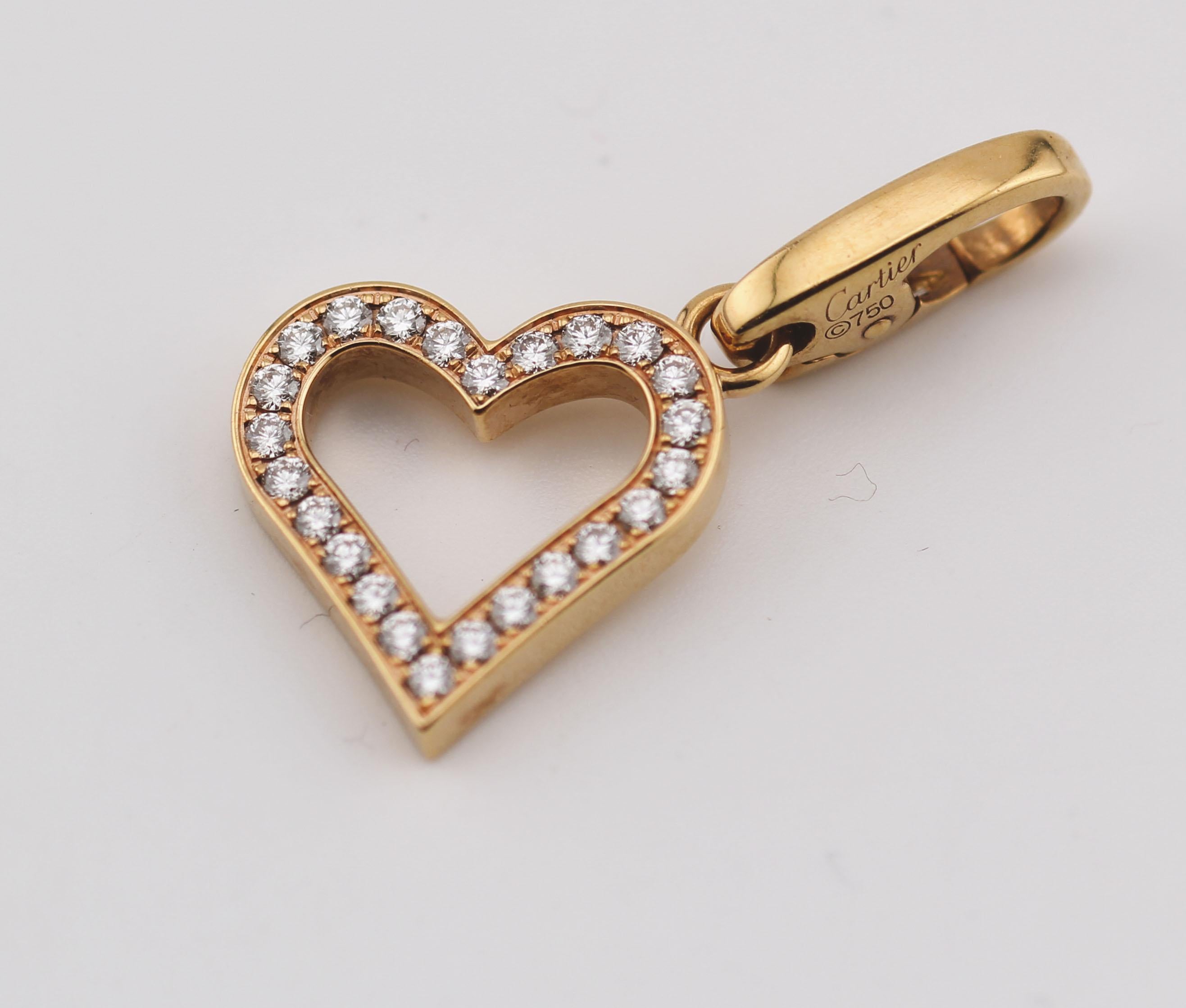 Experience the elegance of Cartier with this stunning heart-shaped charm pendant. Crafted with precision, this piece exemplifies Cartier's dedication to luxury and artistry.

The pendant features a delicate heart outline, adorned with a series of