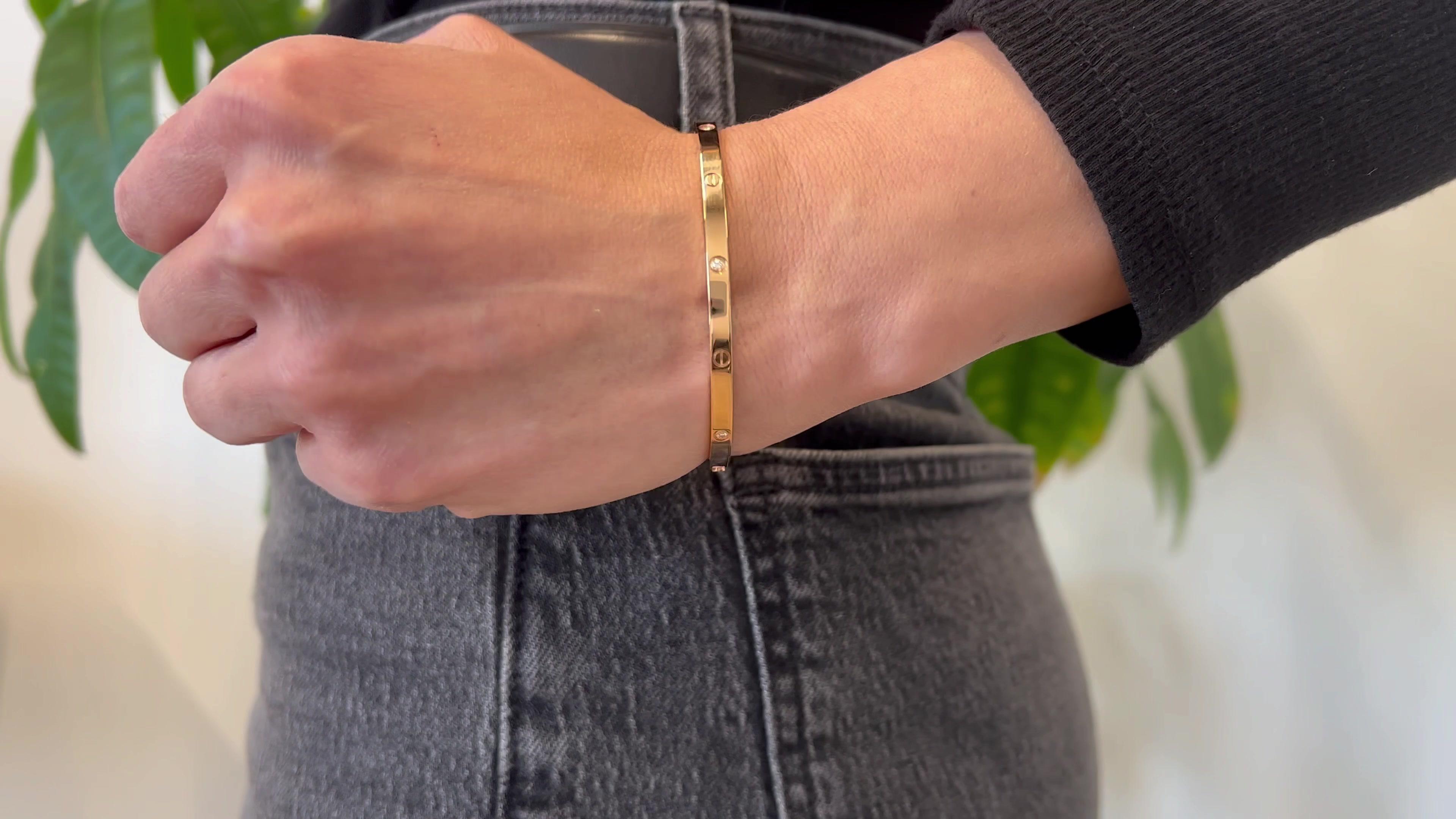 One Cartier Diamond 18k Rose Gold Small Love Bracelet. Featuring six round brilliant cut diamonds with a total weight of 0.15 carat, graded D-E color, VVS-VS clarity. Crafted in 18 karat rose gold signed Cartier serial #SNI400 with purity marks.