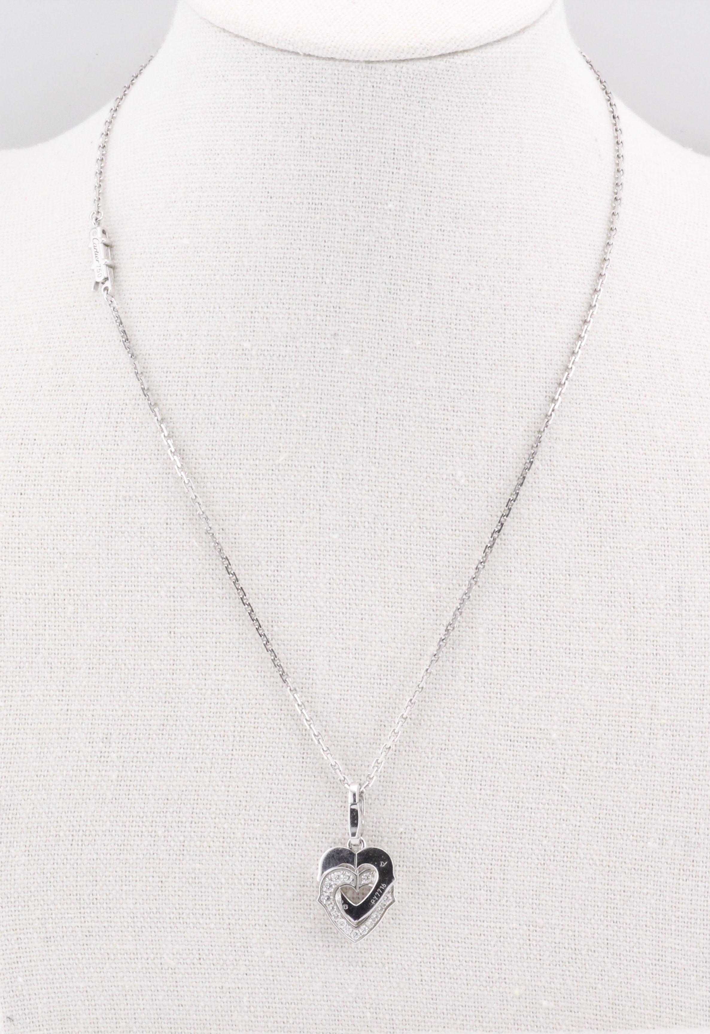 The Cartier Diamond 18K White Gold Double Heart Logo Pendant Necklace is a romantic and elegant piece that captures the essence of love and luxury. Crafted from exquisite 18k white gold, this pendant necklace features a delicate double heart design,