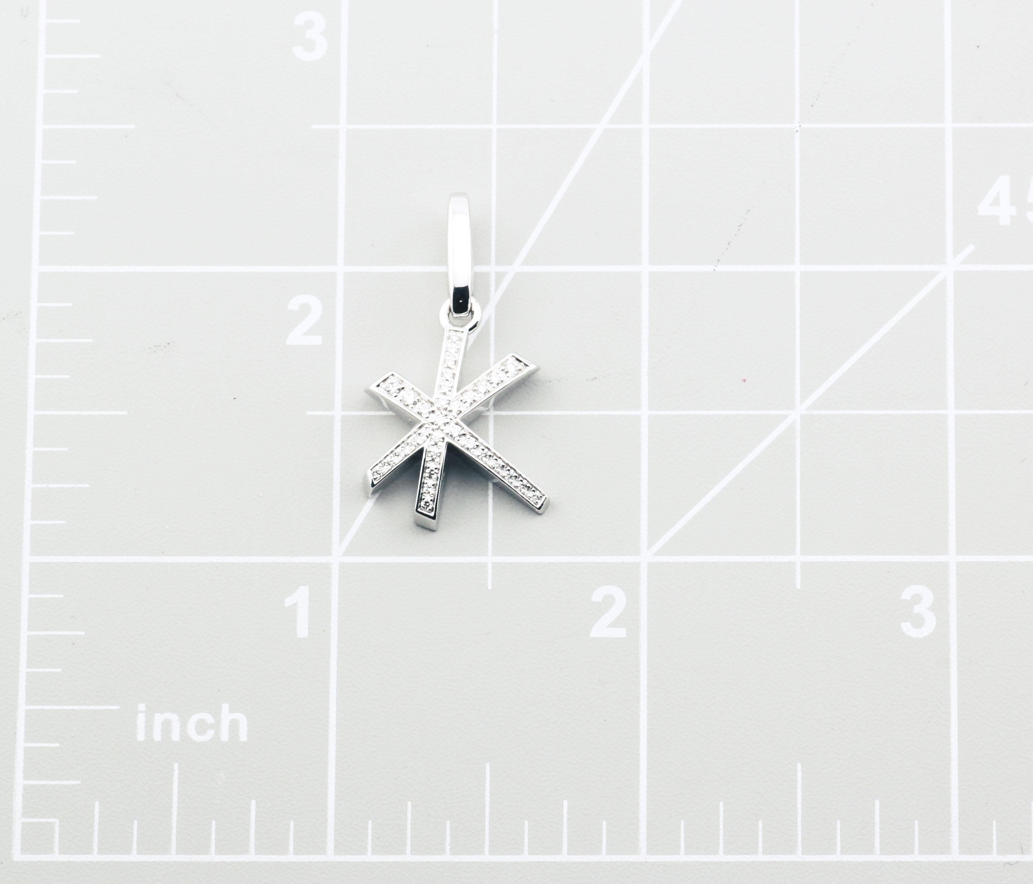 The Cartier Diamond 18K White Gold Fireworks Charm Pendant is a radiant celebration of light and elegance, masterfully crafted to capture the essence of a dazzling fireworks display. This luxurious charm is made from 18k white gold, a choice that
