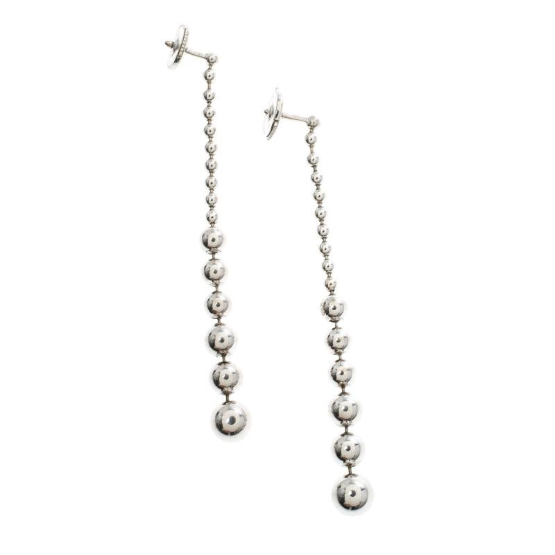 Nothing suits a classy woman better than a pair of classy earrings from Cartier. These beautiful drop earrings are made of 18k white gold and assembled as graduating beads with diamonds on the last beads and push backs are provided for you to put