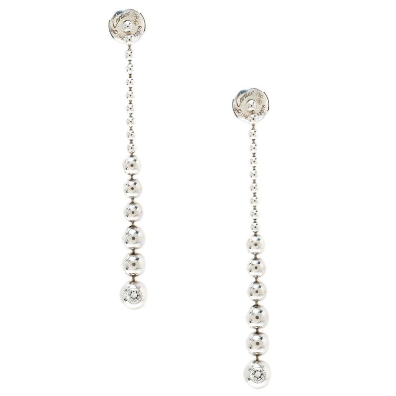 Nothing suits a classy woman better than a pair of classy earrings from Cartier. These beautiful drop earrings are made of 18k white gold and assembled as graduating beads with diamonds on the last beads and push backs are provided for you to put