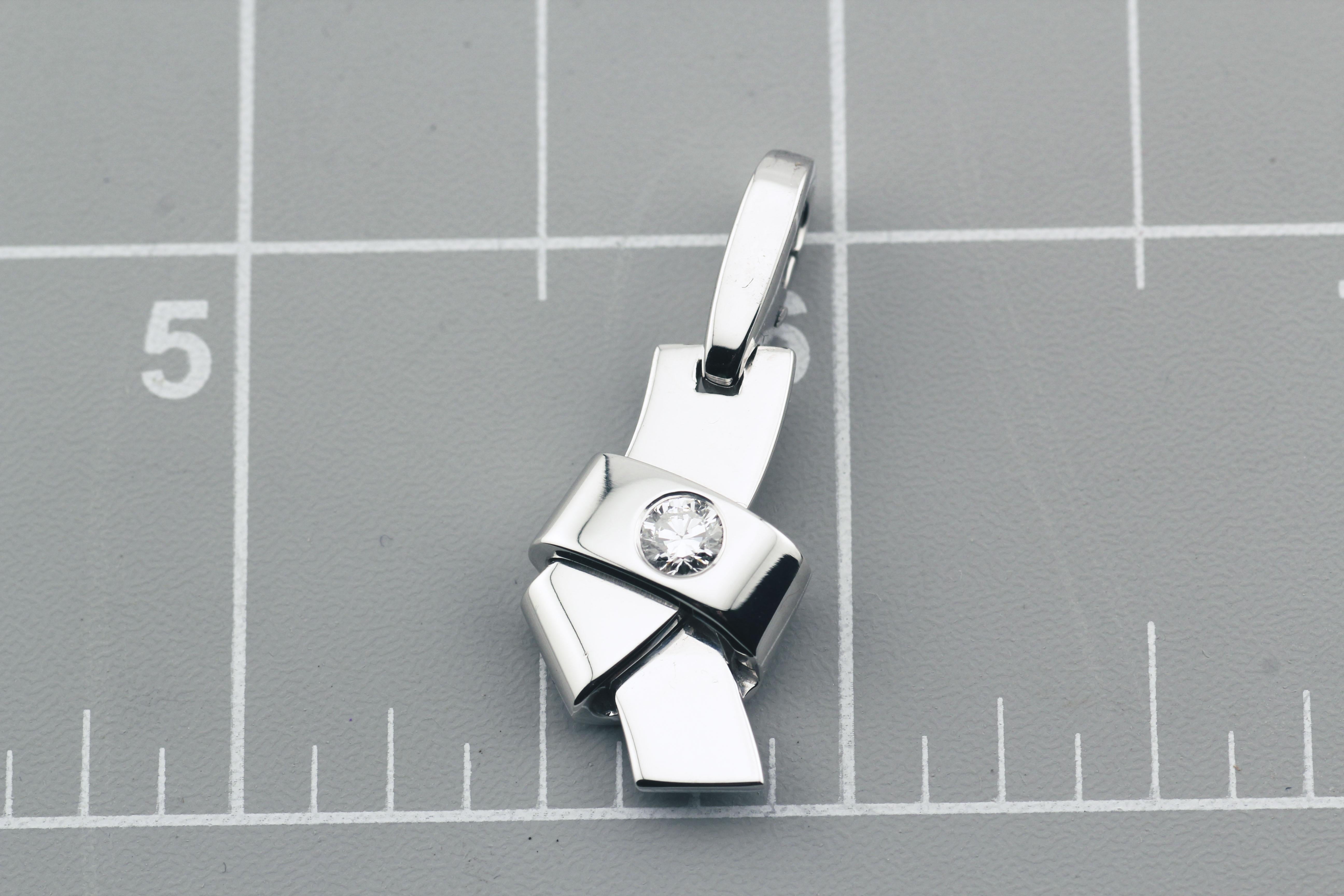 The Cartier Diamond 18K White Gold Knot Charm Pendant is a masterful embodiment of elegance and sophistication, seamlessly blending timeless design with contemporary flair. Crafted from luxurious 18K white gold, this charm features a meticulously